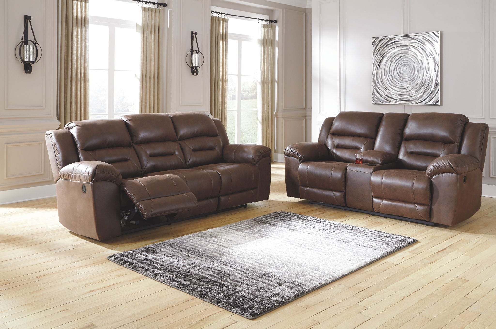 Reclining Living Room Set with chocolate brown padded faux leather upholstery and channel-stitched back cushions for lumbar support.