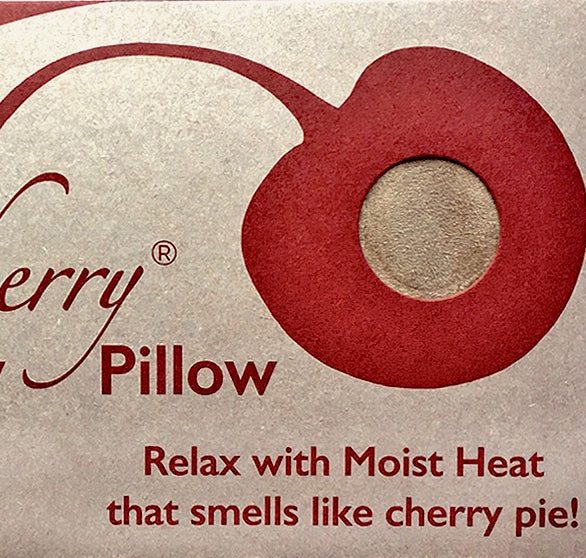 Rectangle/Cervical Pillow label in cream with a red cherry graphic and text promoting moist heat with a cherry pie scent