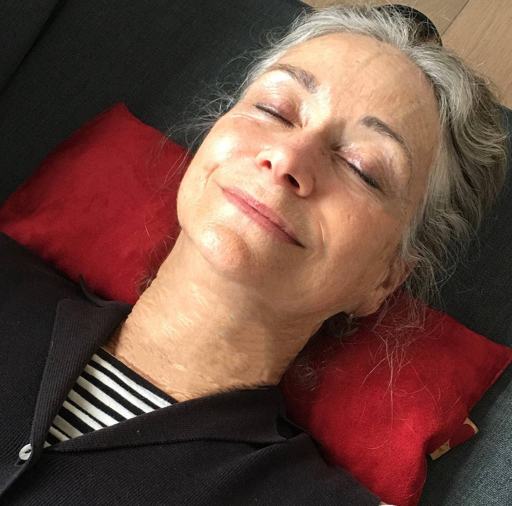 Rectangle/Cervical Pillow in red ultra-suede, a slim rectangular pillow positioned beneath the neck