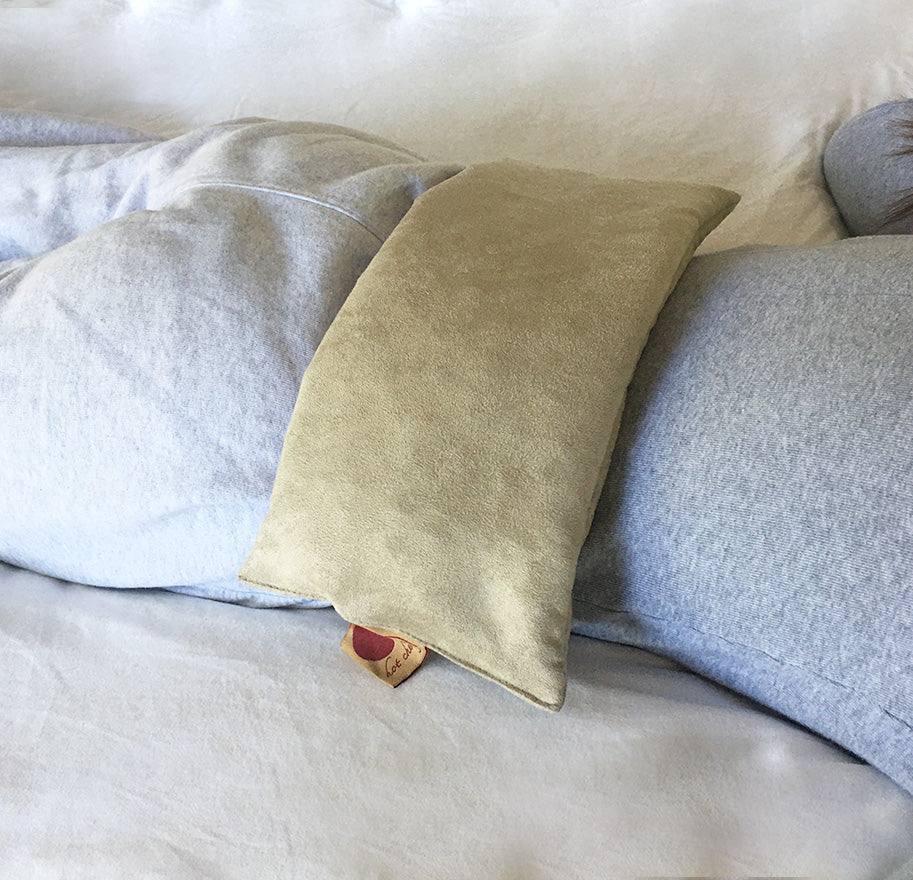 Rectangle/Cervical Pillow in tan ultra-suede with a soft, plain rectangular cover and gently rounded edges