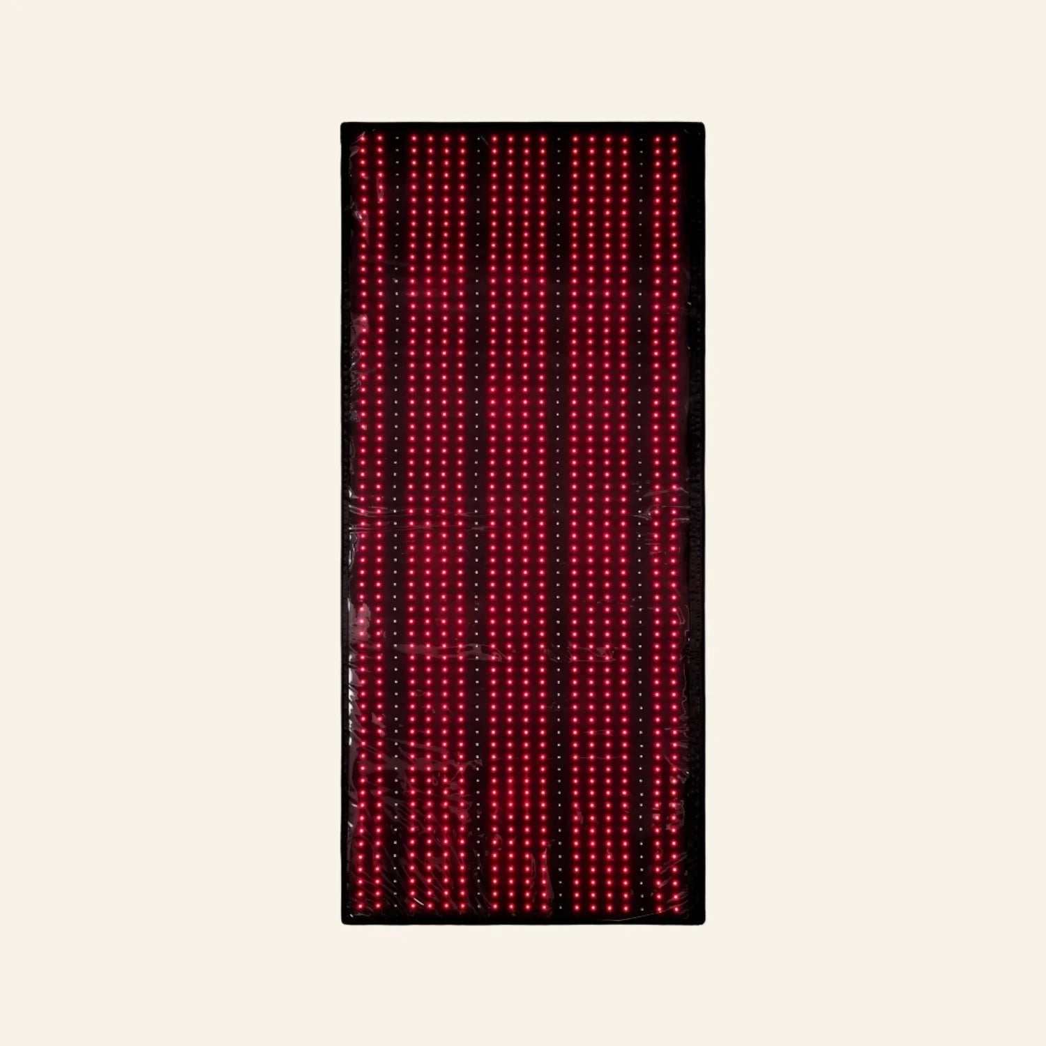 Red Light Therapy Mat with a black rectangular surface and rows of illuminated red LED lights
