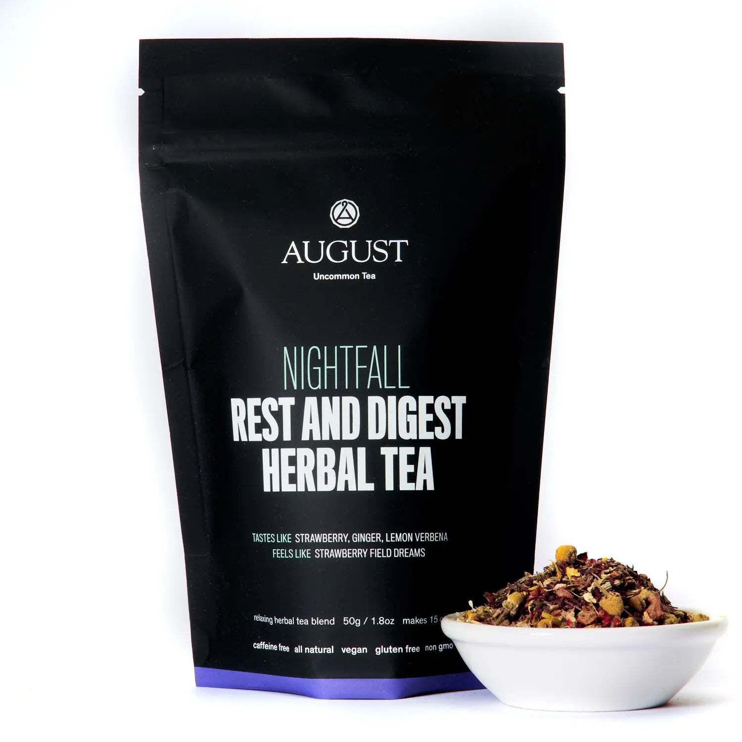 Rest and Digest Herbal Tea in a black Nightfall pouch with a white bowl of loose herbal blend beside it