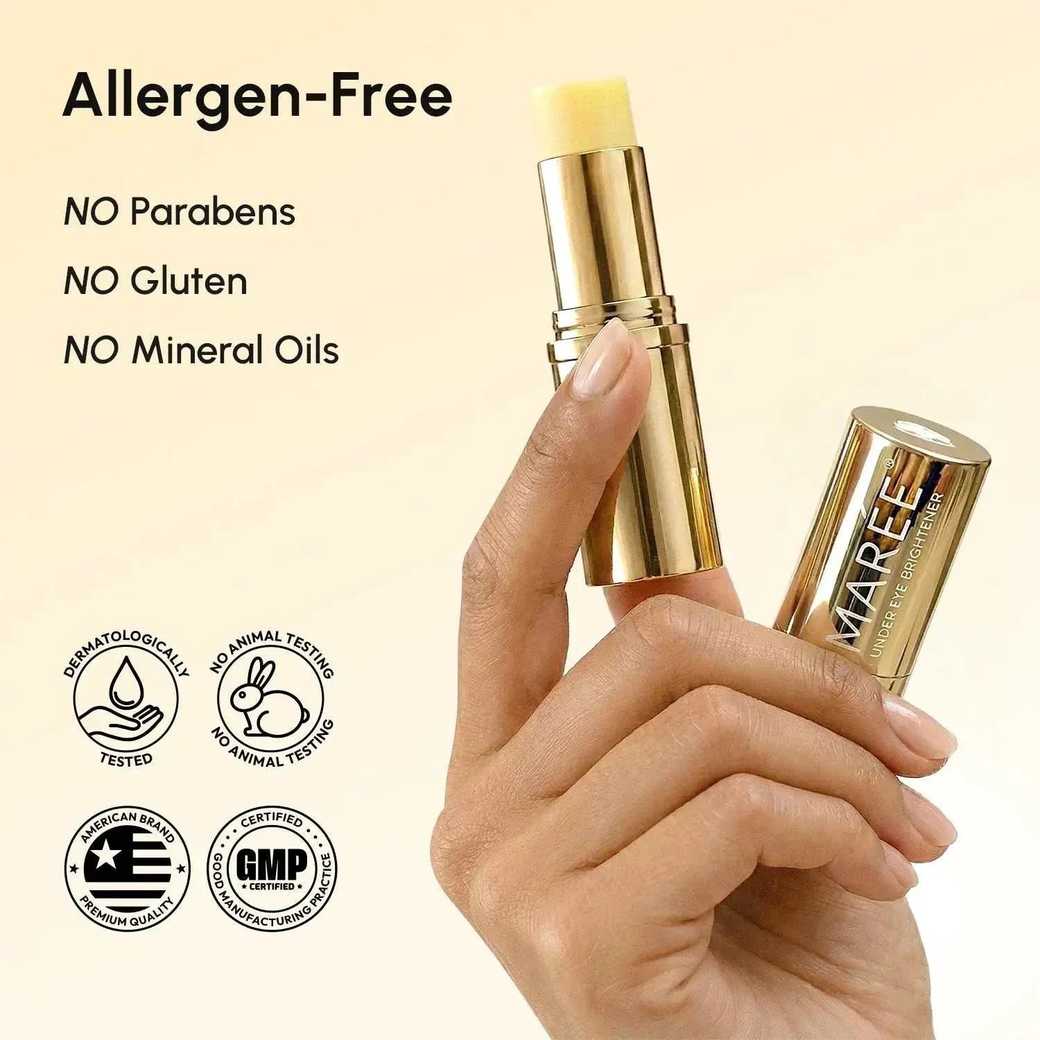 Retinol Under Eye Brightener stick in reflective gold tubes with pale balm tips, displayed in a hand beside allergen-free claims.