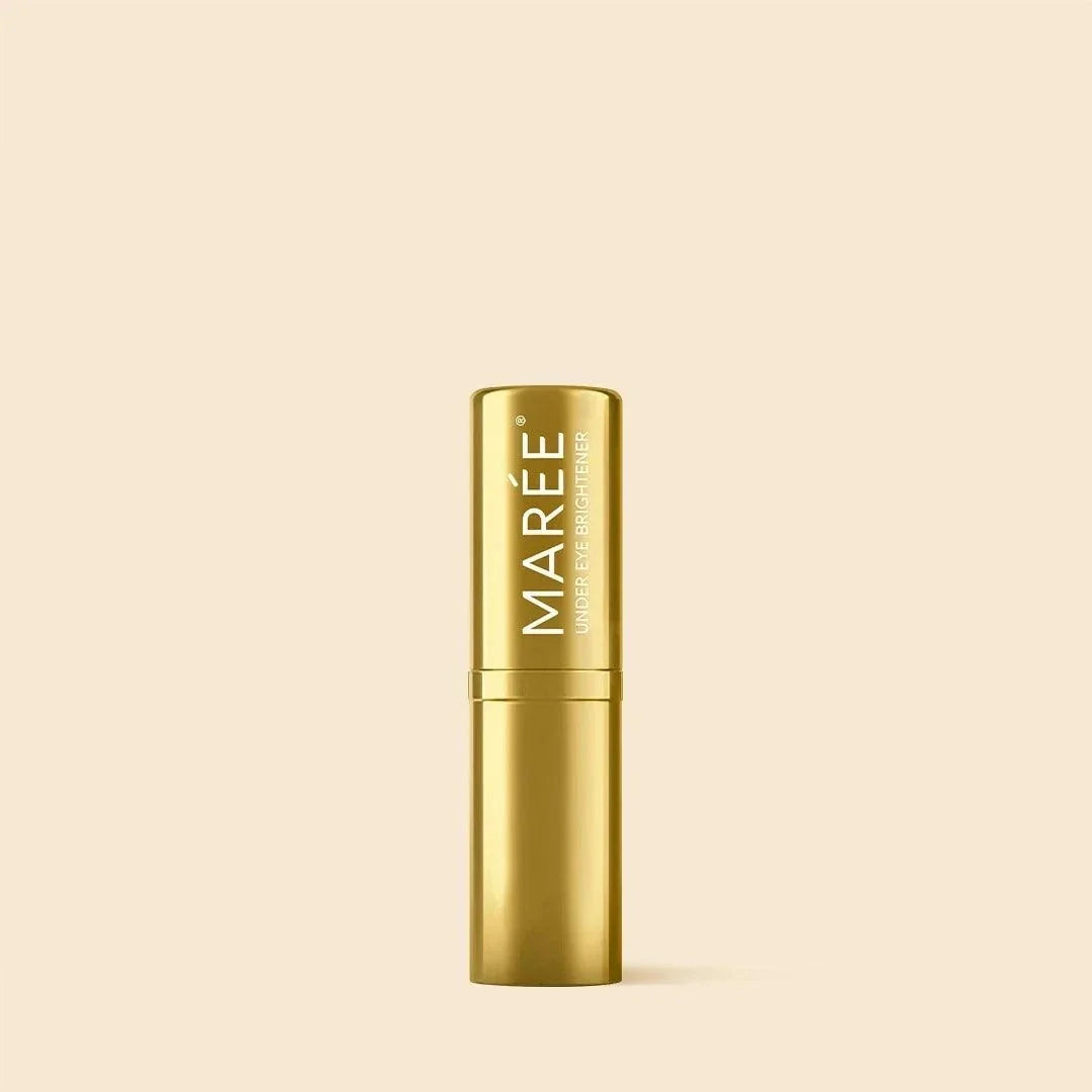 Retinol Under Eye Brightener in a glossy gold cylindrical stick tube with white vertical MAREE branding.