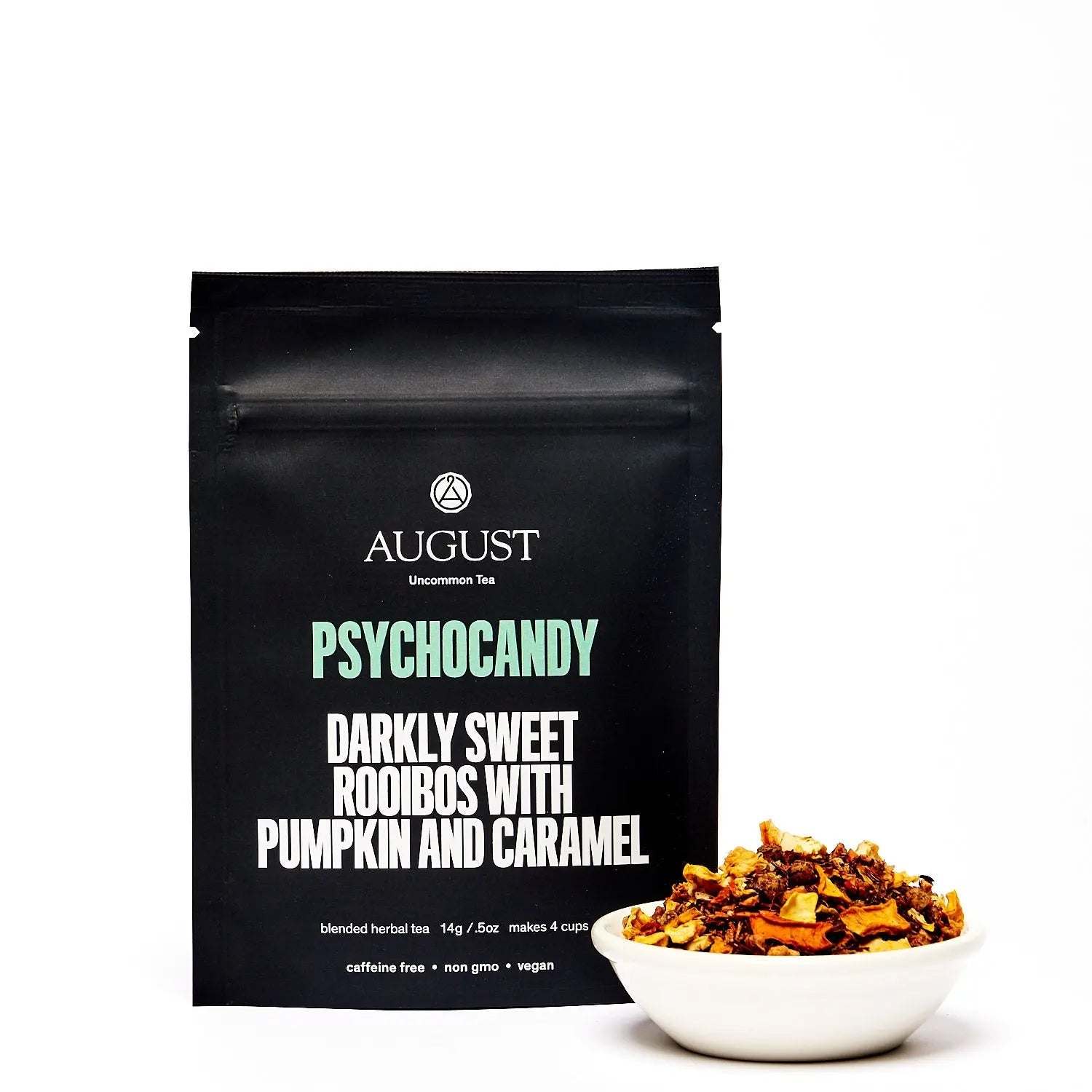 Roasted Pumpkin Caramel Rooibos Tea in a black Psychocandy pouch with a bowl of chunky dried pumpkin and tea blend.