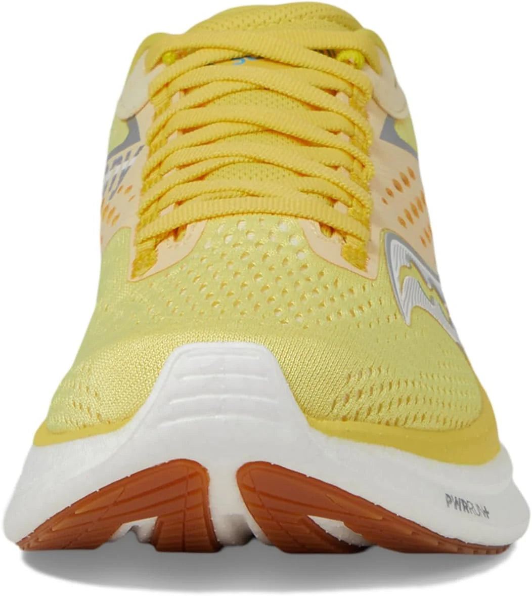Saucony Women's Ride 17 running shoe in bright yellow mesh with matching laces, white midsole, and rust-orange outsole