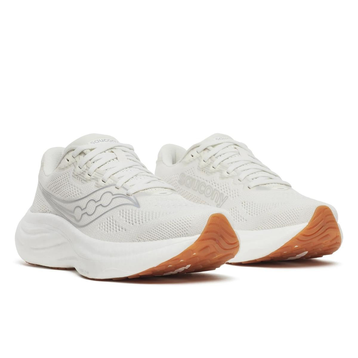 Saucony Women's Ride 19 running shoes in white mesh with tonal overlays, white cushioned soles and orange rubber outsoles