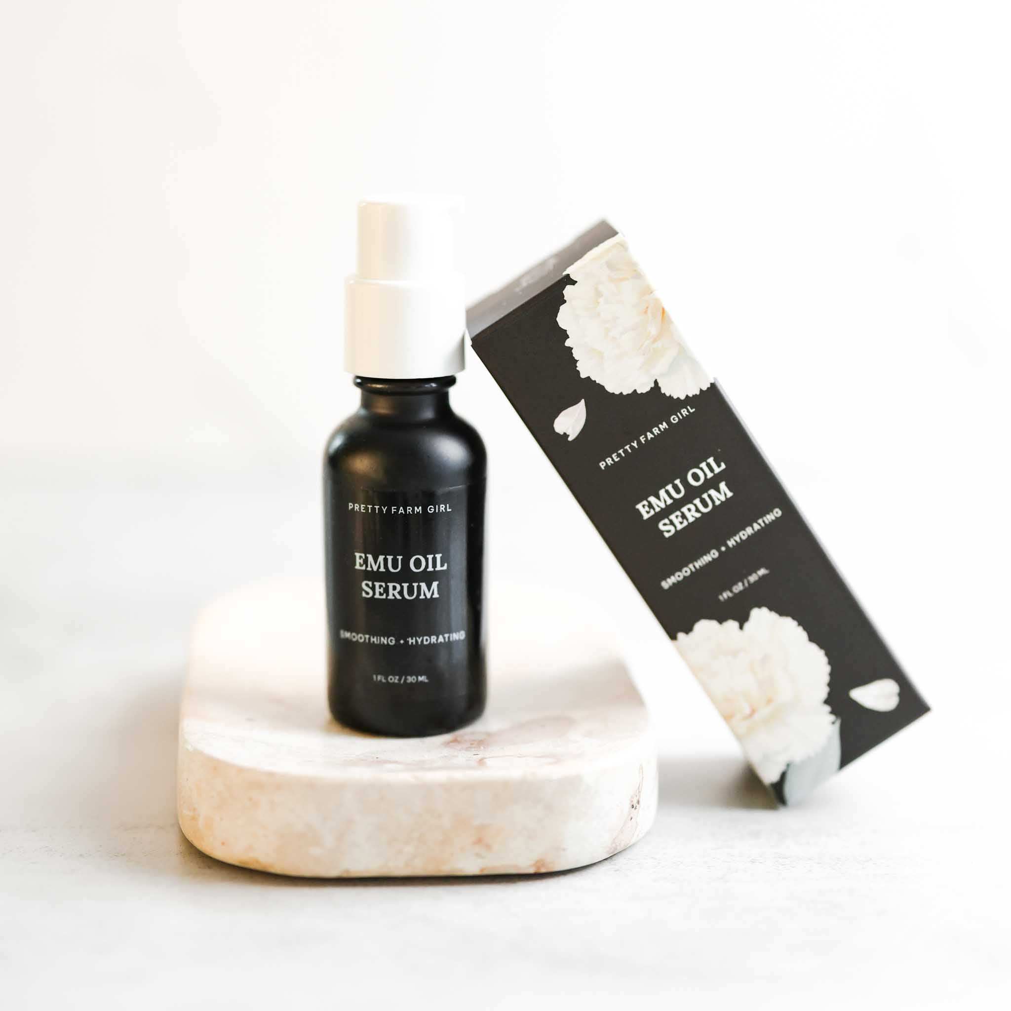 Sensitive Skin Fragrance Free Kit featuring a black Emu Oil Serum bottle with white pump and matching floral box