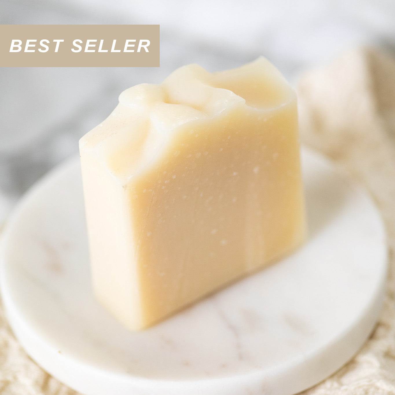 Sensitive Skin Fragrance Free Kit featuring a cream-colored handmade tallow and honey soap bar with a sculpted top