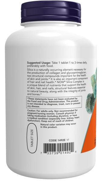 Silica Complex supplement bottle with a white plastic body, dark purple cap, and orange-green label accents
