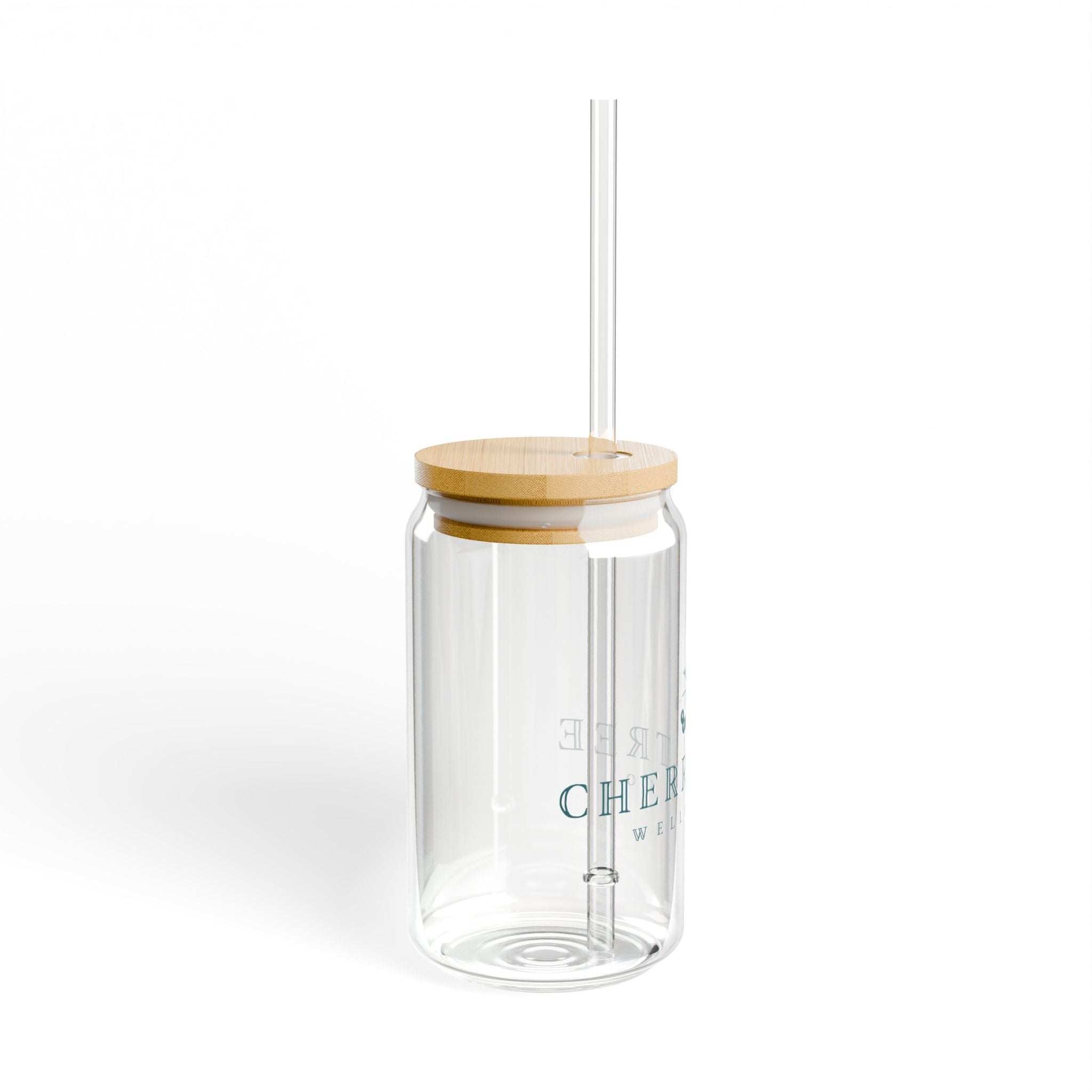 Sipper Glass 16oz in clear tempered glass with a bamboo lid, transparent straw, and subtle printed lettering