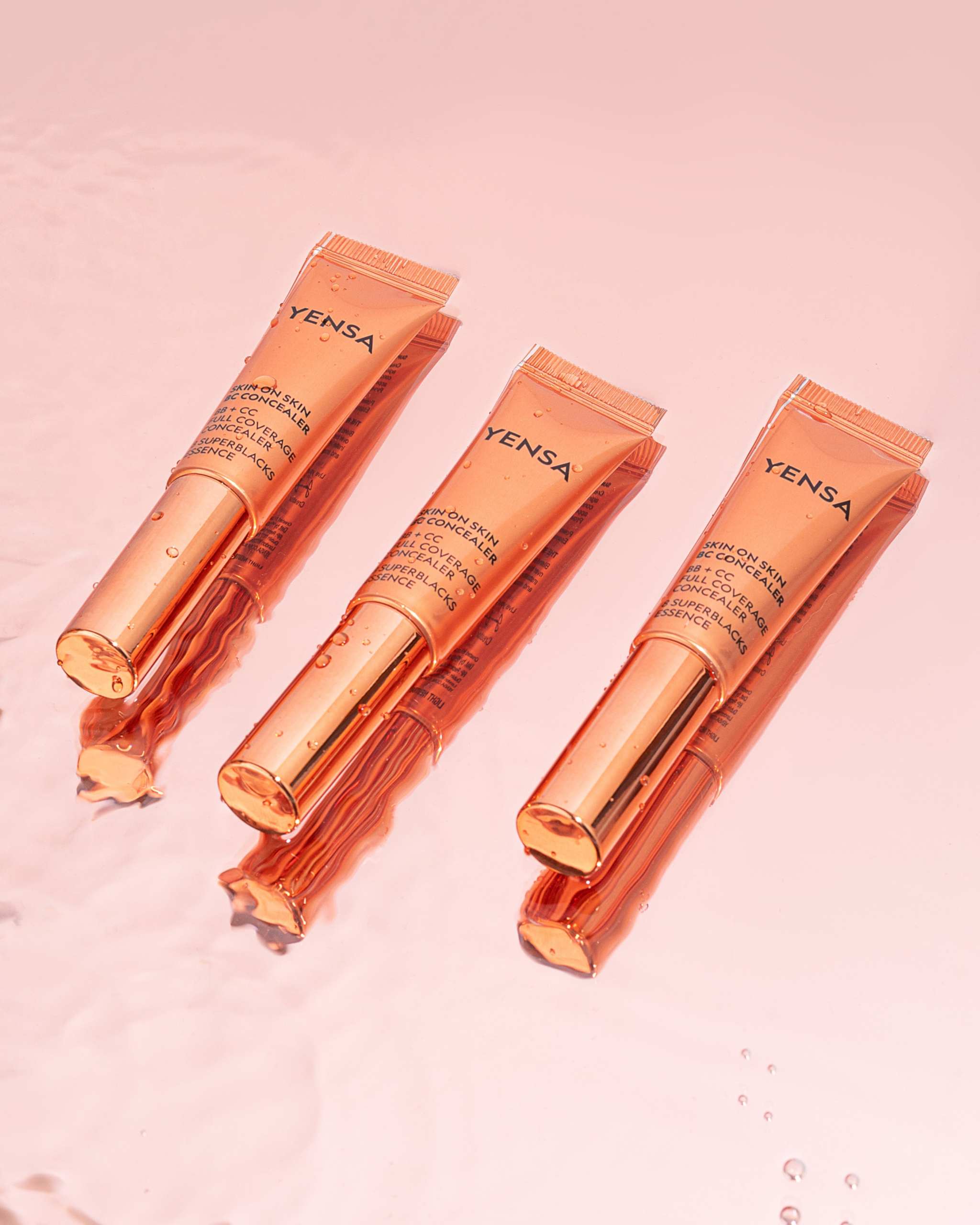 Skin On Skin BB concealer in orange metallic squeeze tubes with tapered applicator tips and black lettering