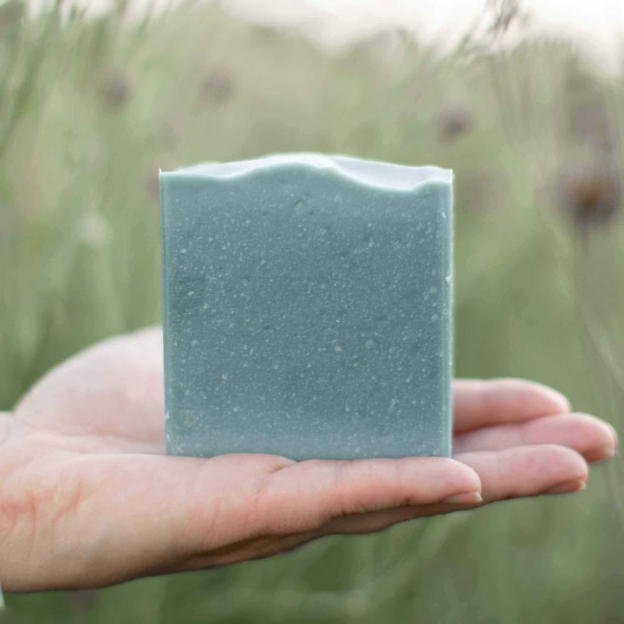 Skin Redness Skincare Routine Kit blue-green soap bar with a smooth rectangular shape and speckled texture