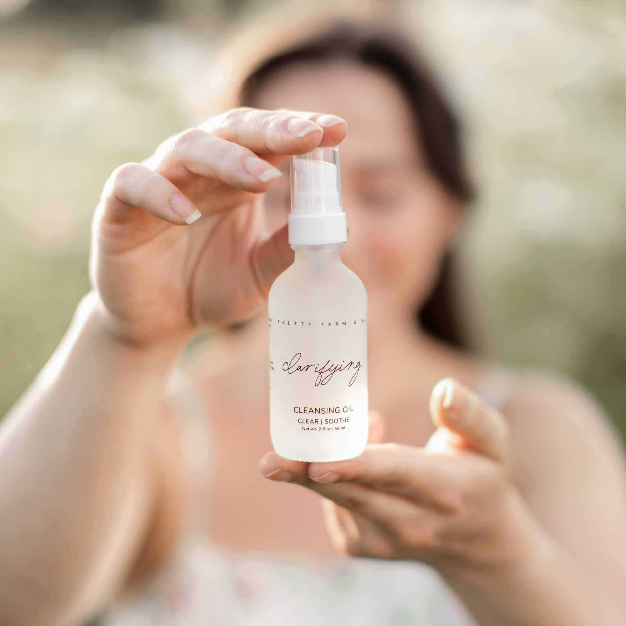 Skin Redness Skincare Routine Kit clarifying cleansing oil in a white glass pump bottle with script label