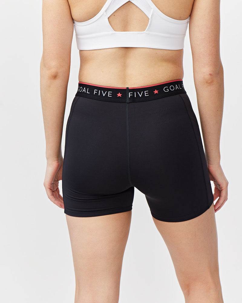 Slide Force Women's Spandex Shorts in black stretch fabric, with a branded black waistband and red star details