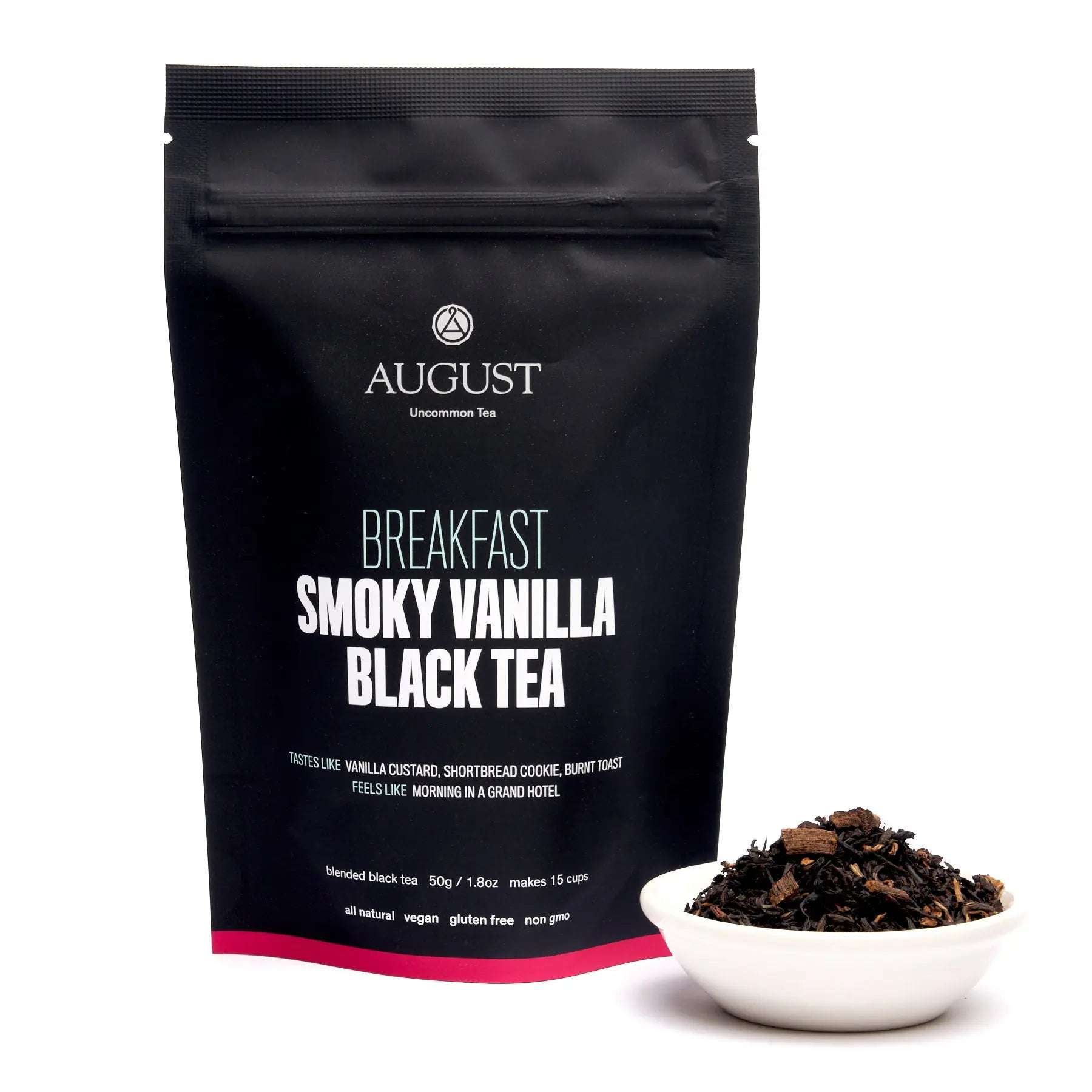 Smoky Vanilla Black Tea in a matte black resealable pouch with white lettering and a bowl of loose tea leaves