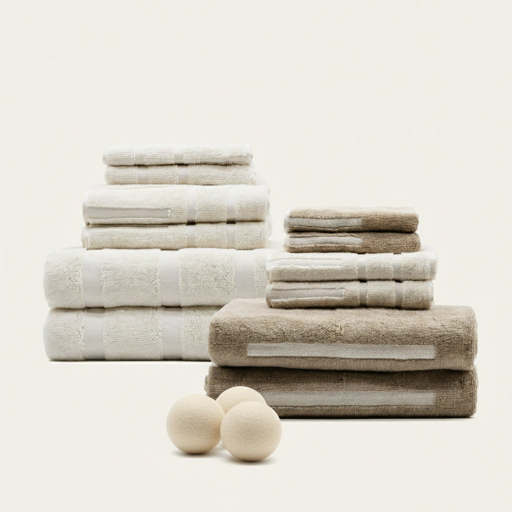 Sorrel Australian Cotton towels in cream, ivory and sand, stacked in assorted sizes with plush woven textures