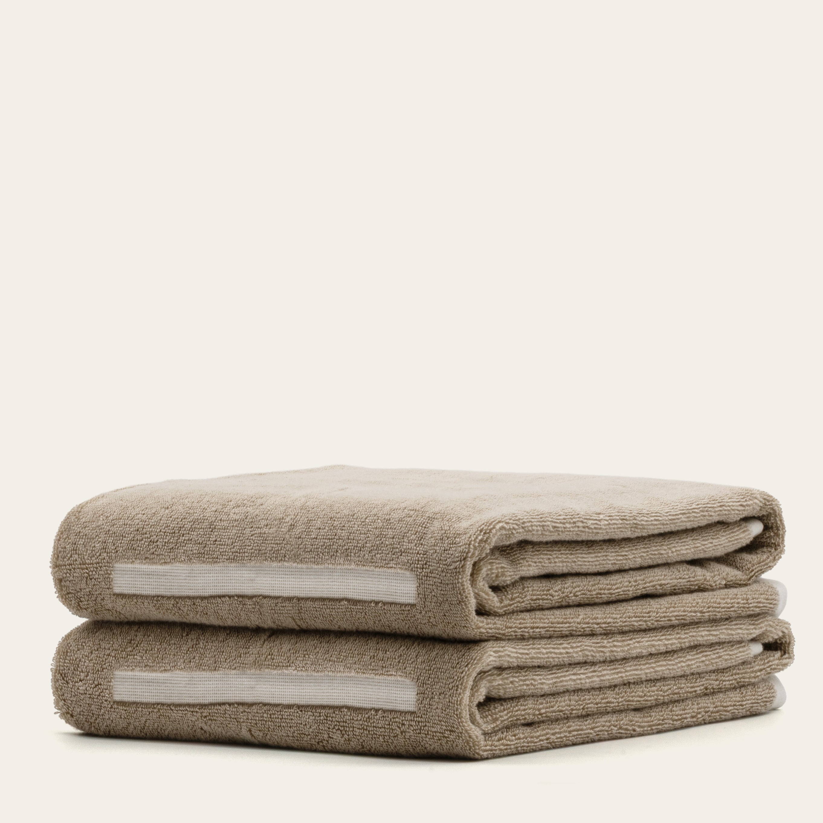 Sorrel Australian Cotton bath towels in a warm taupe shade, with plush textured cotton and pale woven bands