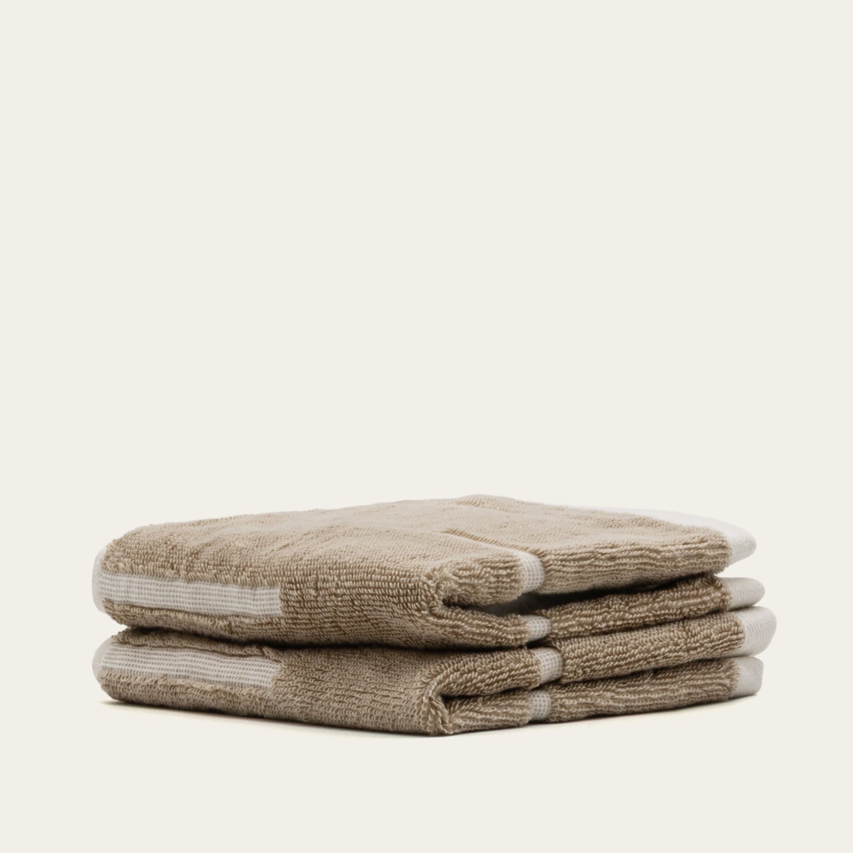 Sorrel Australian cotton towels set in sand tone with geometric accents