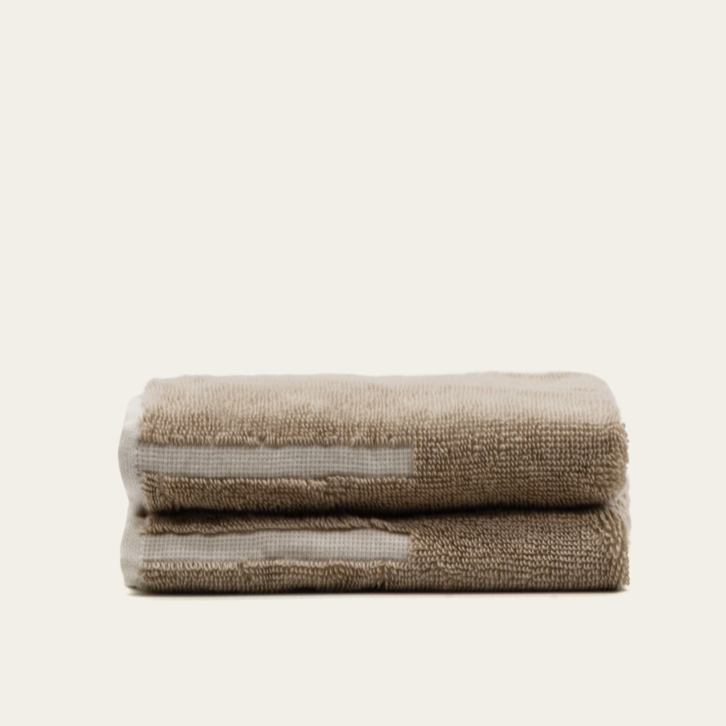 Sorrel Australian cotton towels in sand tone with geometric accents