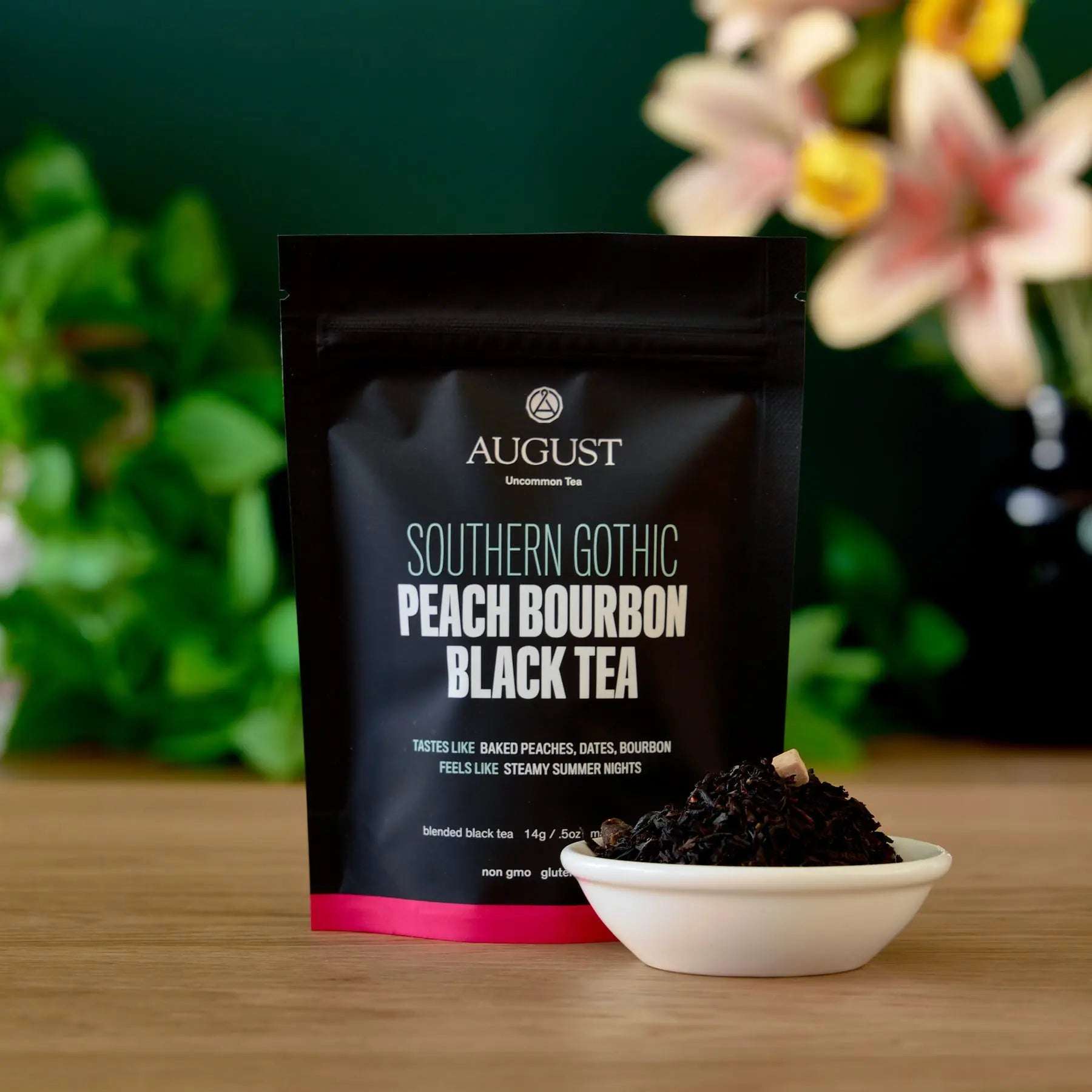 Southern Gothic - Peach Bourbon Black Tea black pouch with peach bourbon tea label and loose black tea in a bowl