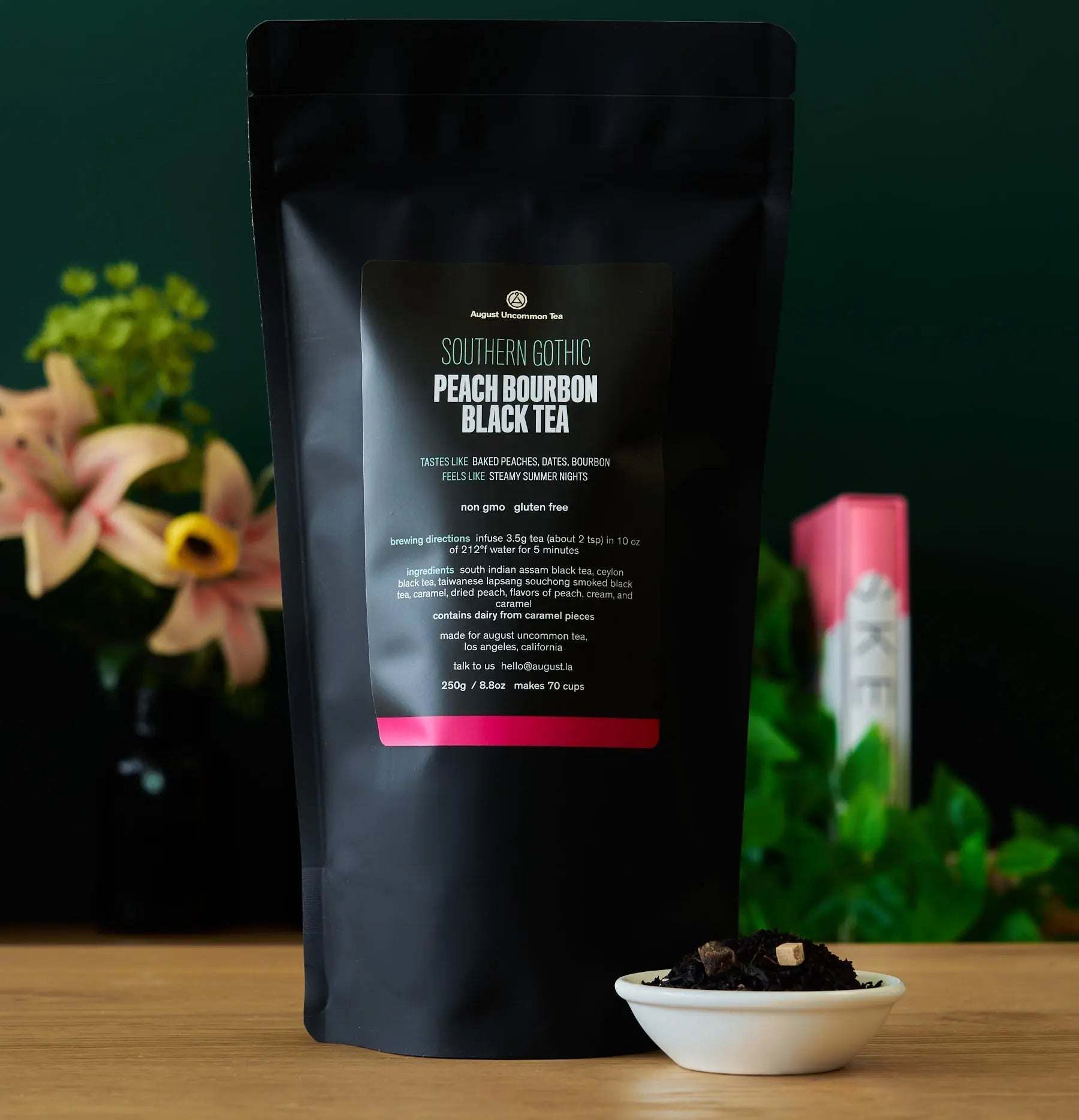 Southern Gothic - Peach Bourbon Black Tea in a matte black resealable pouch with a pink label and loose tea bowl