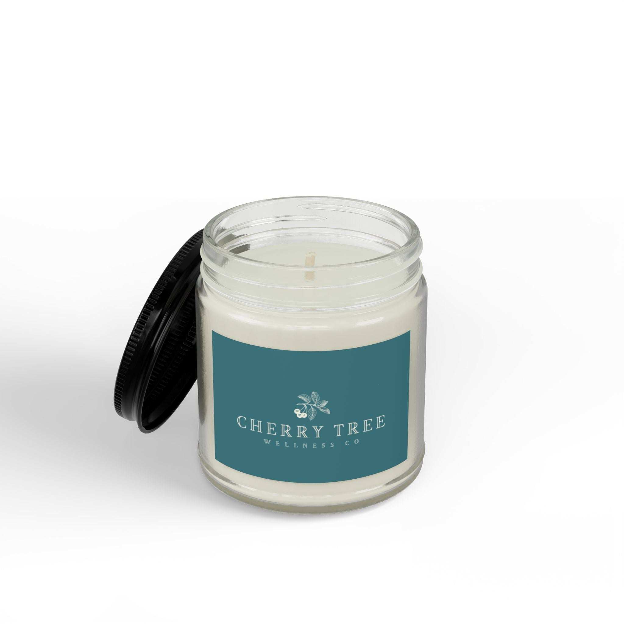 Soy Candle in a clear glass jar with a black screw lid, white natural soy wax, and a teal Cherry Tree Wellness Co. label