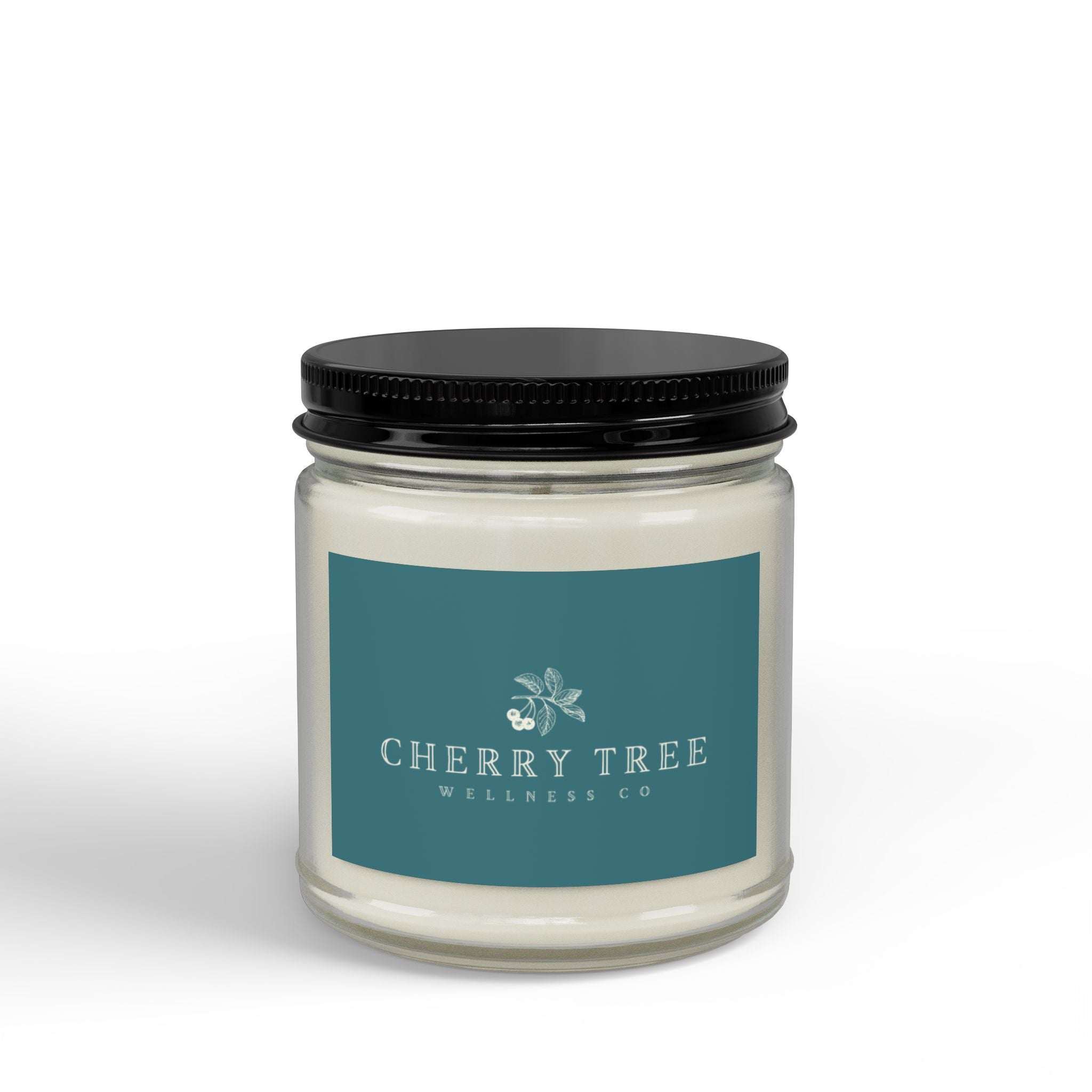 Soy Candle in a clear glass jar with black screw lid, featuring a teal label with white text from Cherry Tree Wellness Co.