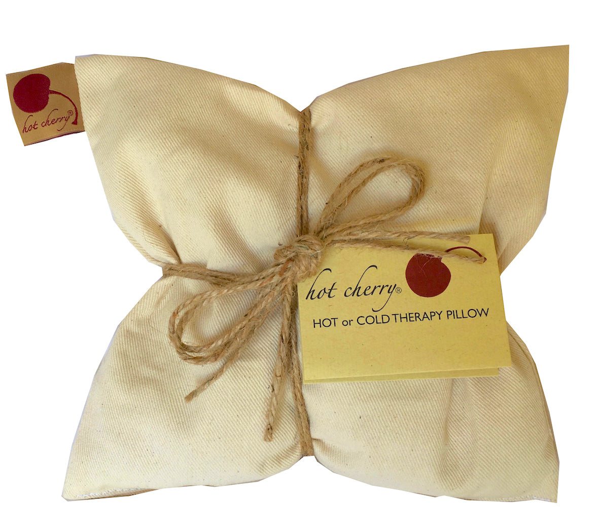 Square Pillow in Natural Denim, a cream unbleached fabric pillow tied with rustic twine and a Hot Cherry tag