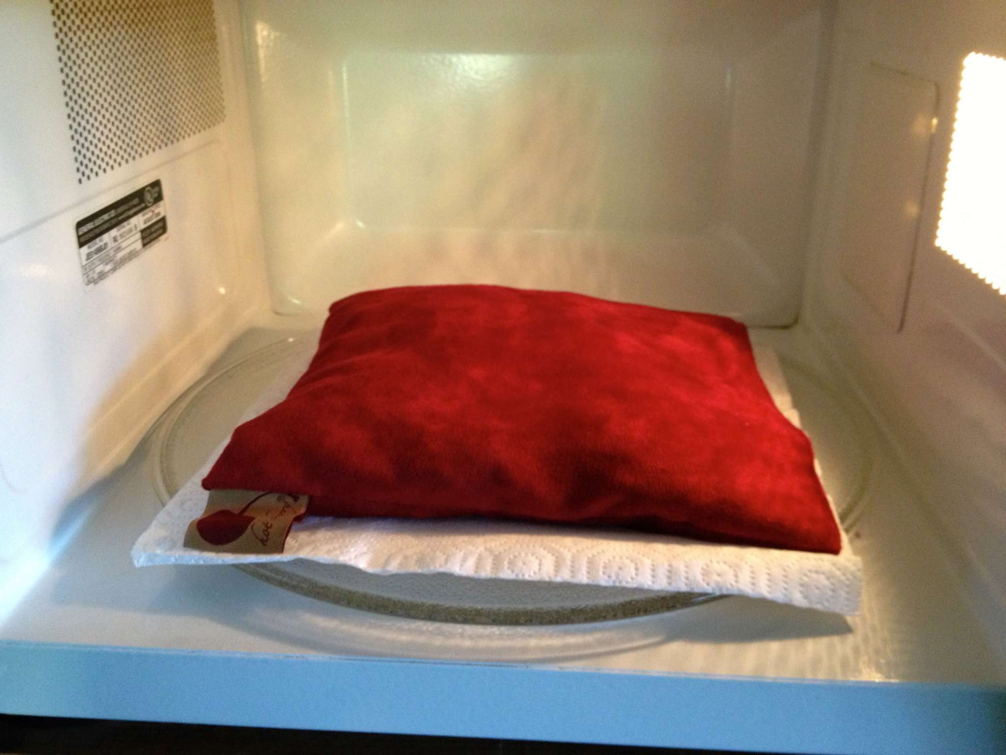 Square Pillow in Plush red ultra-suede fabric, with a soft rectangular shape and smooth, solid-colour surface