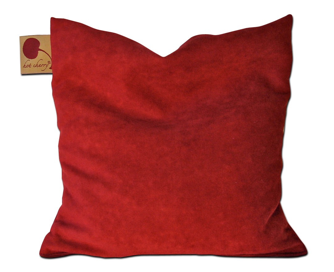 Square Pillow in Plush, deep red ultra-suede with a soft textured surface and gently pointed top corners