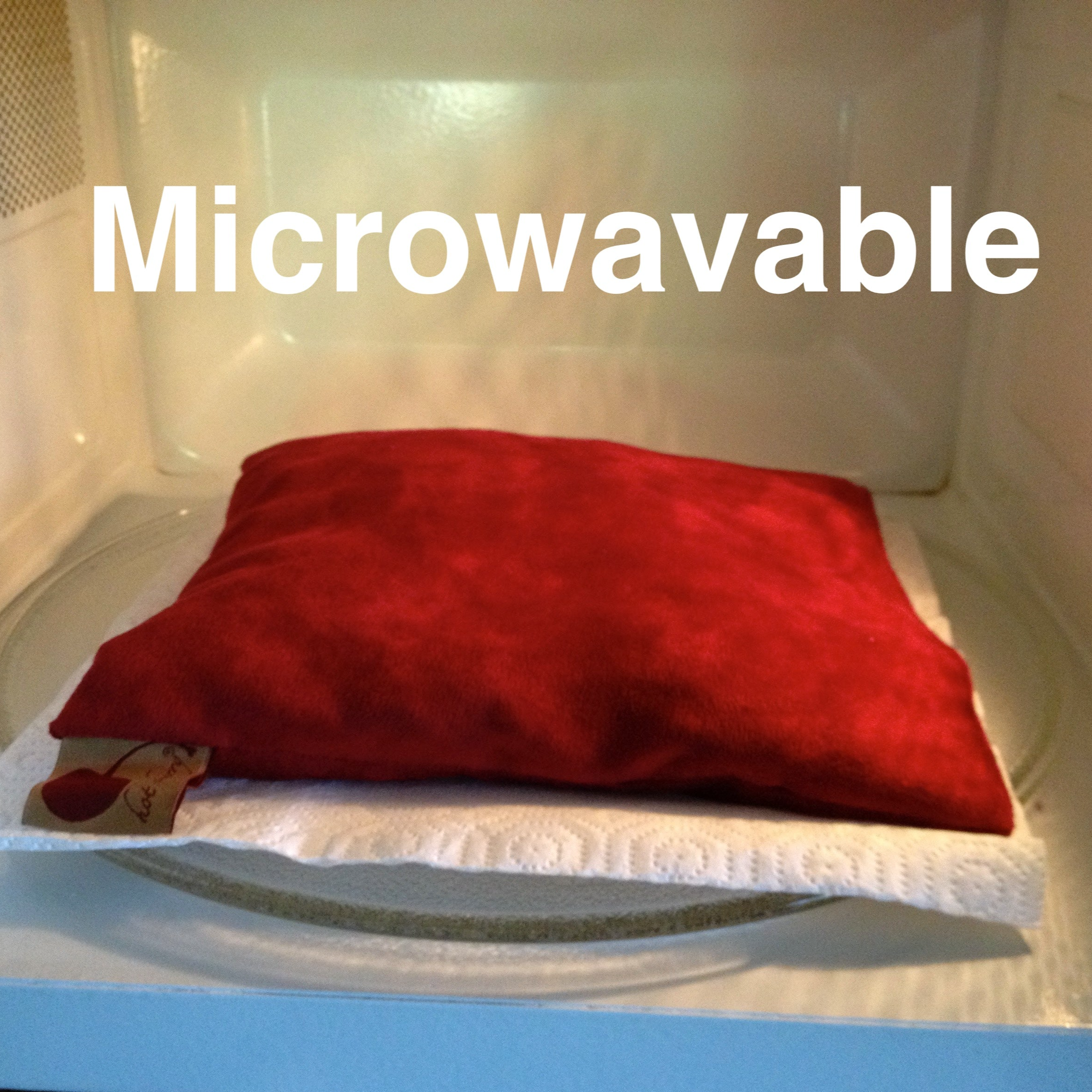 Summer Stack microwaveable pillow in solid red fabric, square and softly filled with a smooth surface