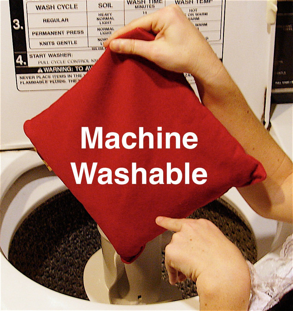 Summer Stack red square denim pillow with a plain finish, held at an open washing machine; machine washable.