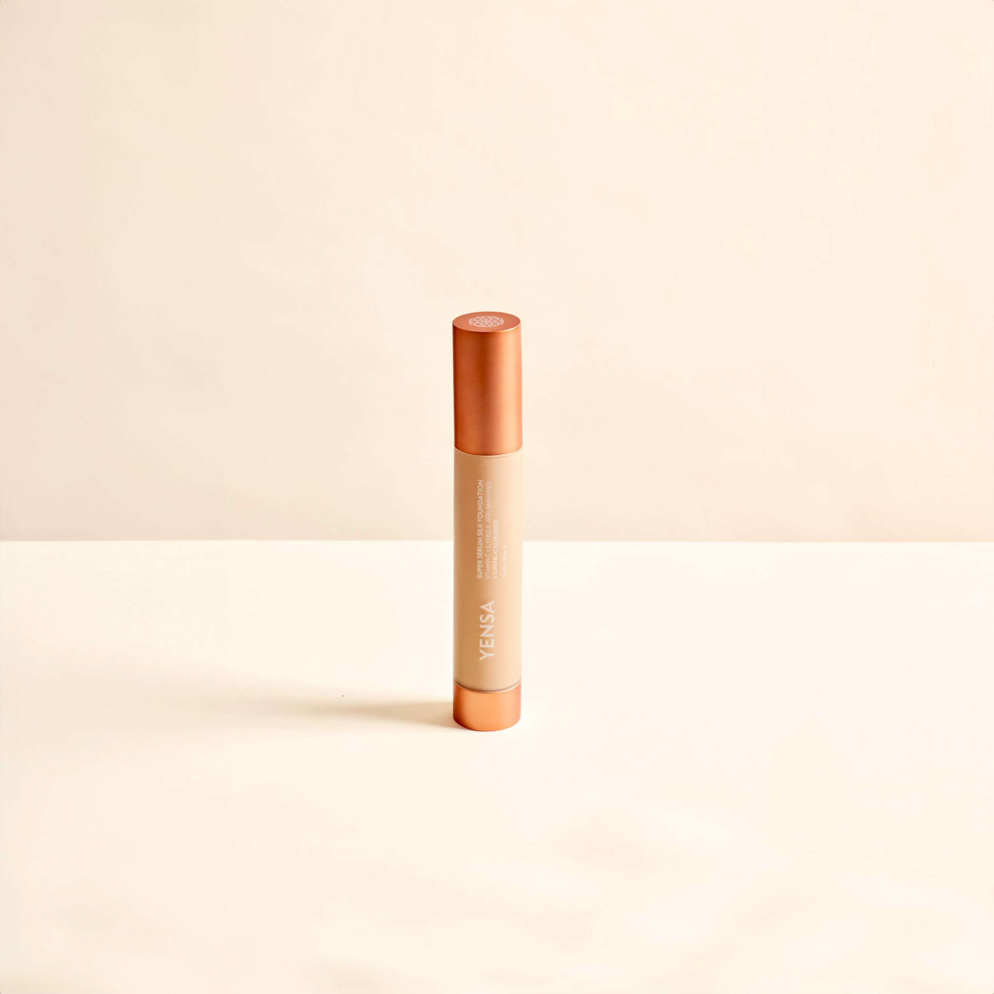 Super Serum Silk foundation in a slim beige tube with a copper-colored cap and natural glow finish
