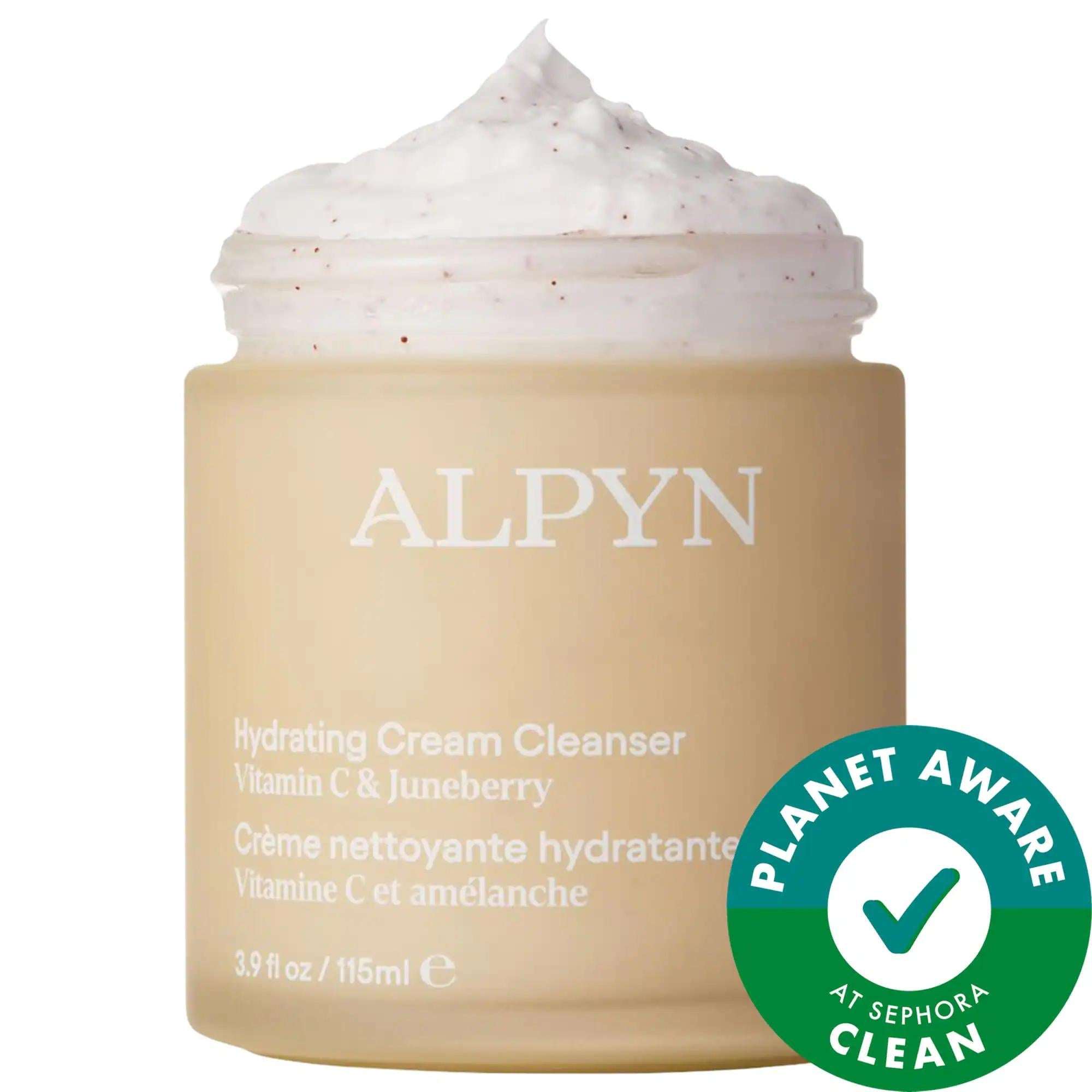 Cream facial cleanser in a beige jar with white whipped texture, labeled Vitamin C & Juneberry; Superberry and Vitamin C-infused Cleanser