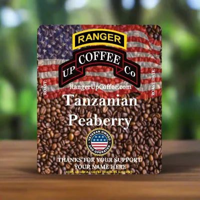Tanzanian Peaberry Coffee in a brown bean-patterned bag with an American flag design and custom support message