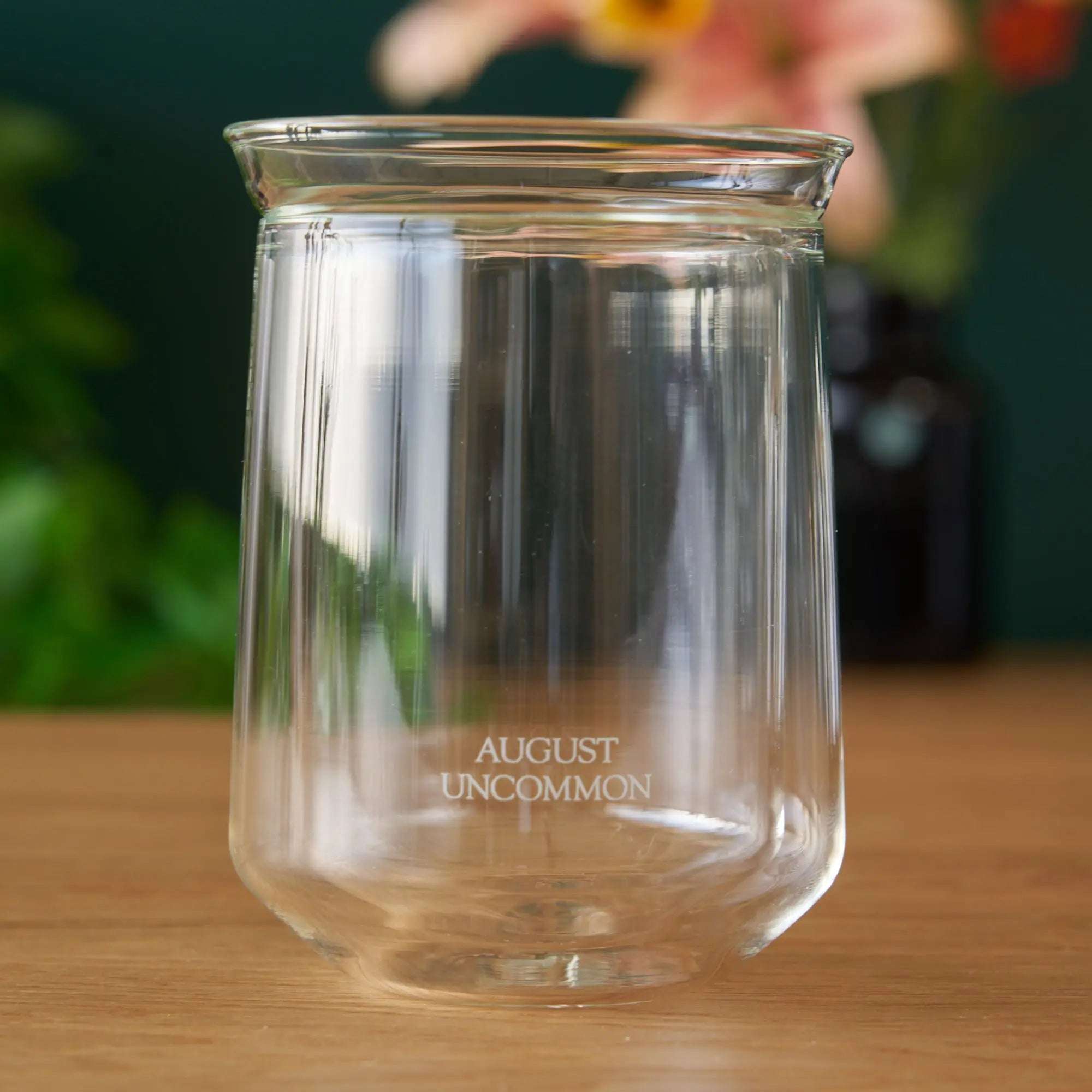 Tasting Glass made from clear double-walled glass with a flared rim and August Uncommon logo