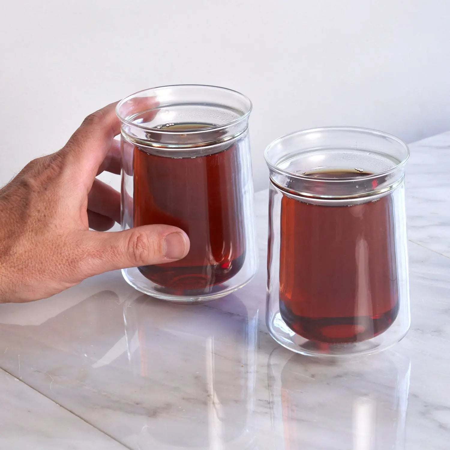 Tea For Two - Starter Tea Set with two clear double-walled glass cups filled with amber tea