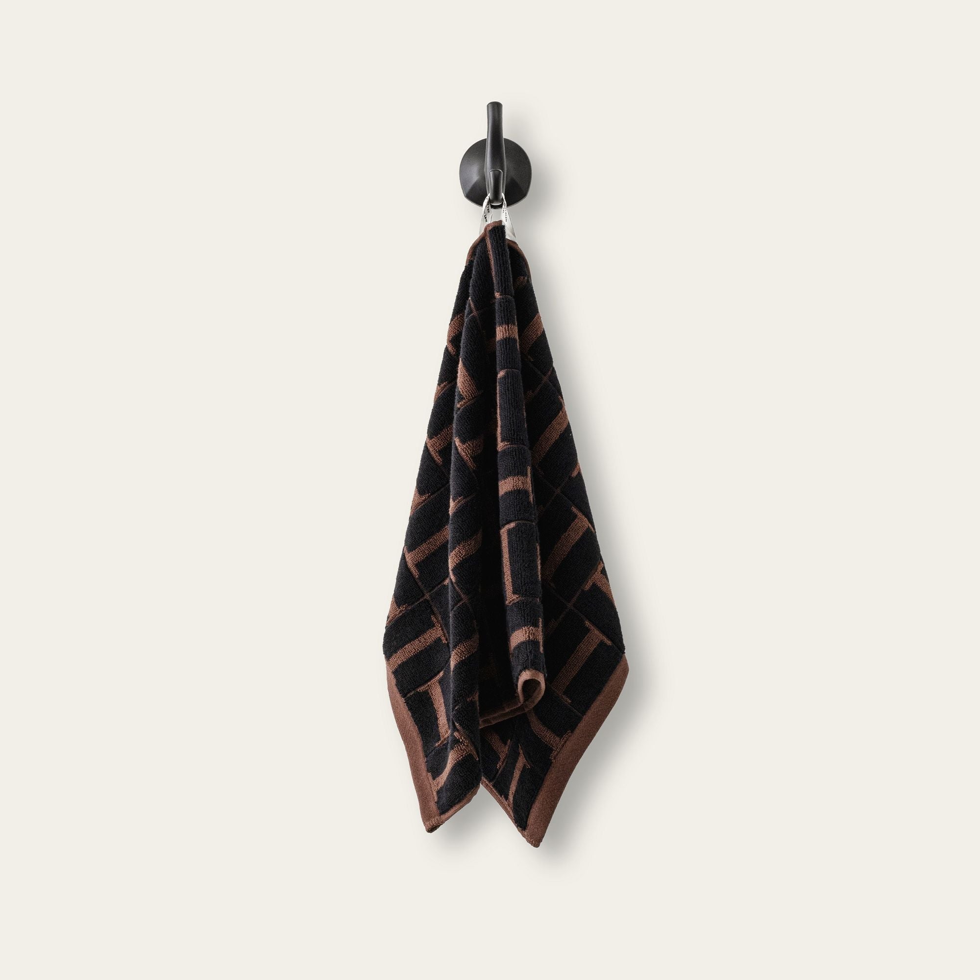 Tessera Australian cotton towels in moody coastal tones with geometric pattern