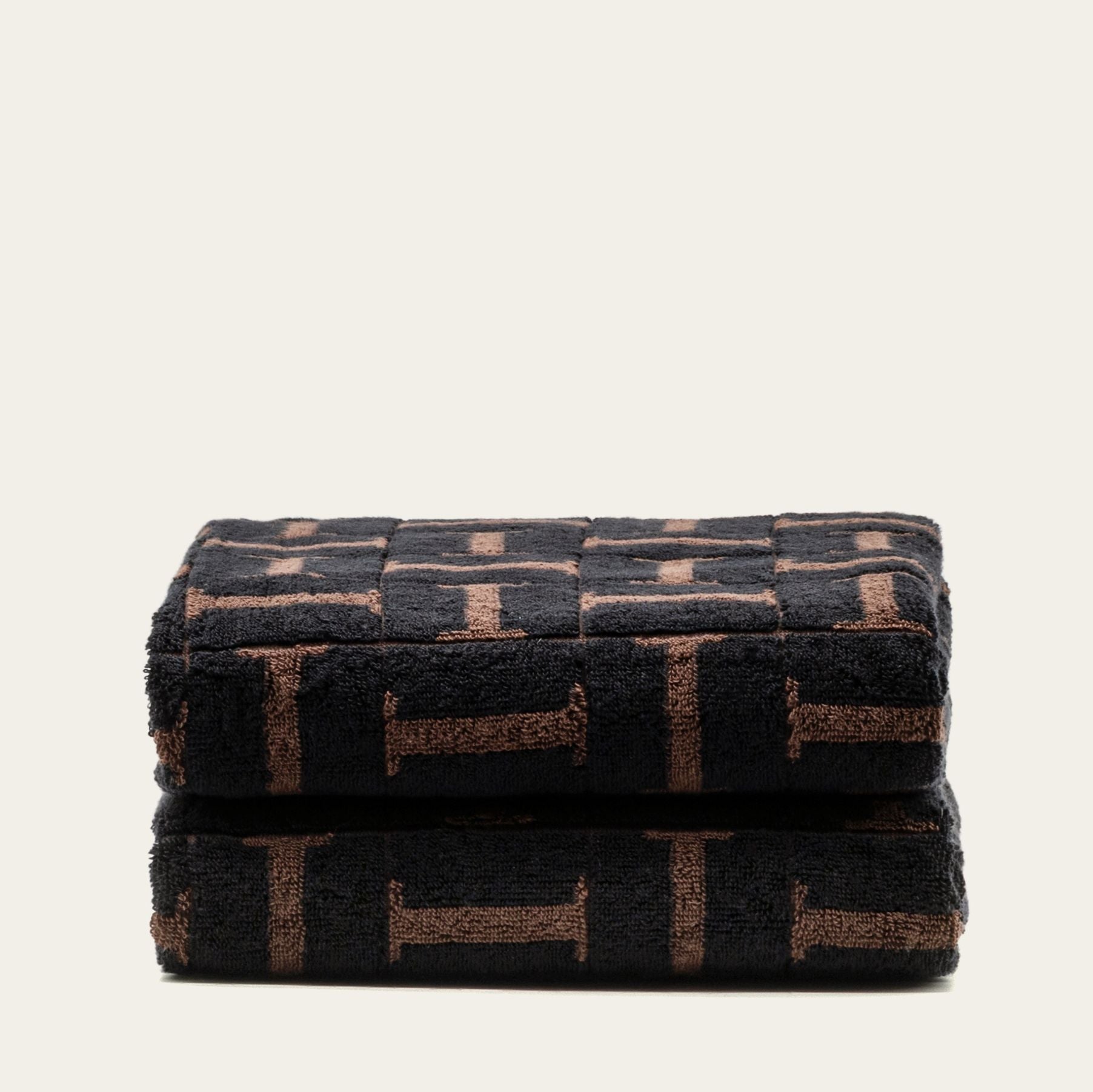 Tessera Australian cotton towels in moody coastal tones with geometric pattern