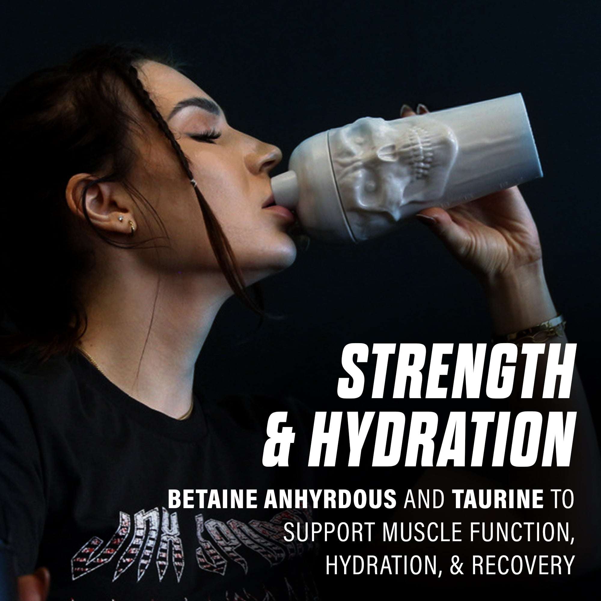 Woman drinking from a white skull embossed shaker bottle with text highlighting strength and hydration benefits, featuring The Curse! Stim-Free Pump