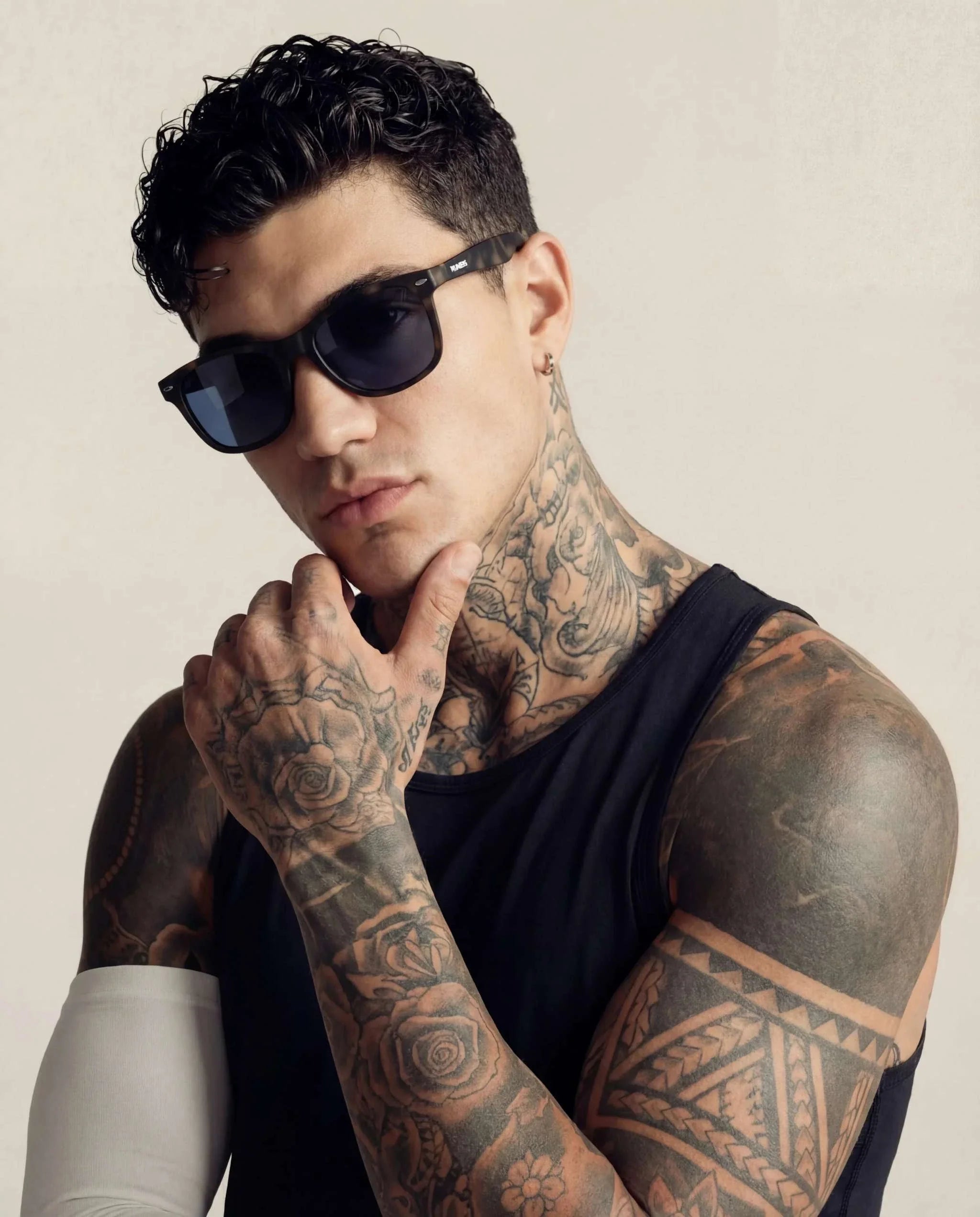 Tortoise Square Sport Sunglasses with dark square lenses and a patterned brown-and-black frame, worn by a tattooed model