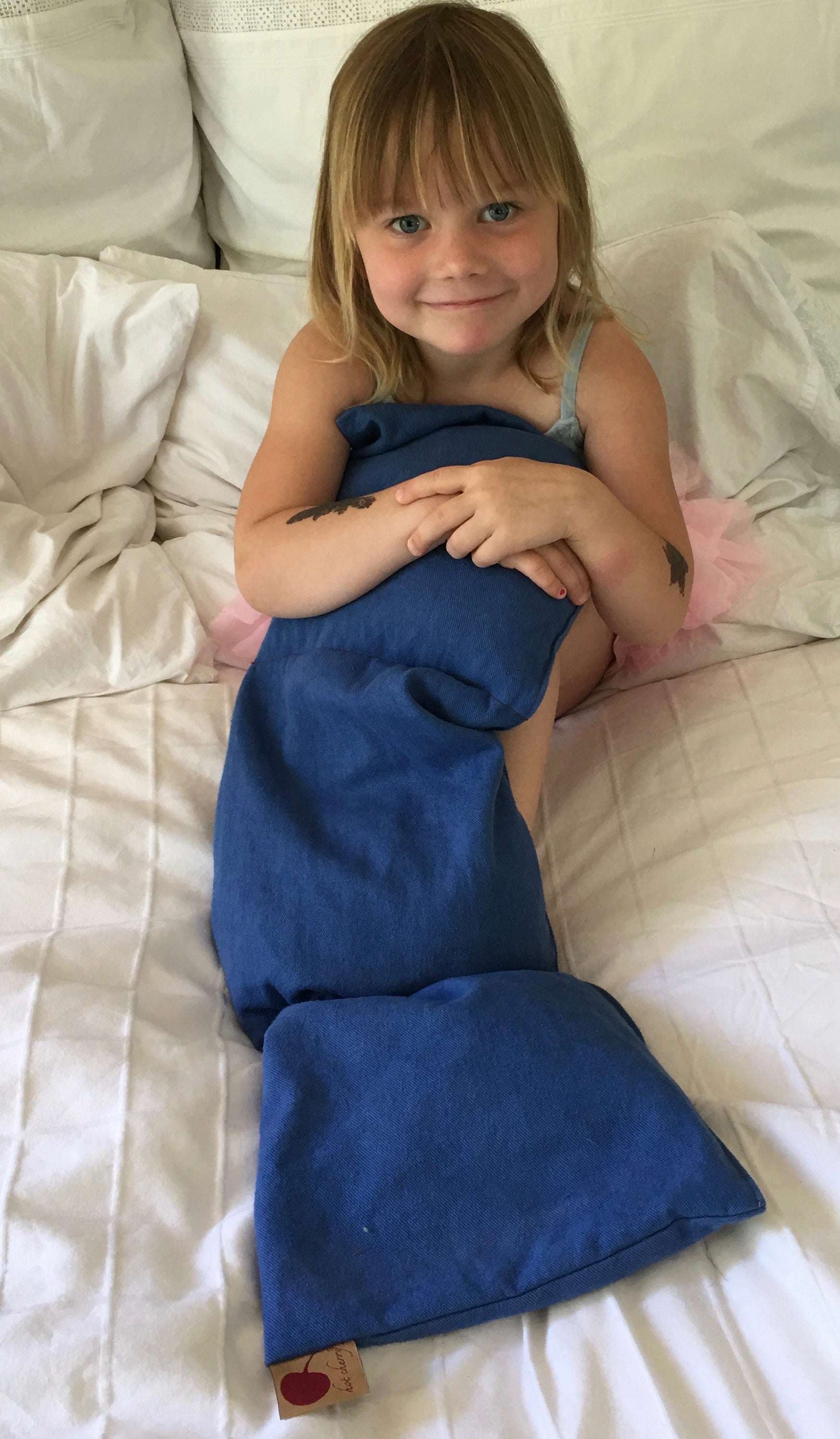 Triple Square Pillow in rich blue cotton denim, with an elongated shape and visible stitched seams