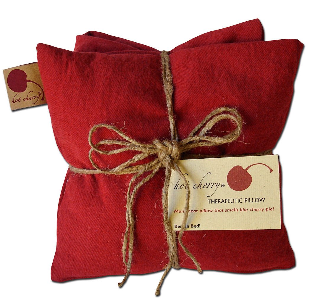 Triple Square Pillow in red cotton denim, bundled with twine and a therapeutic pillow tag