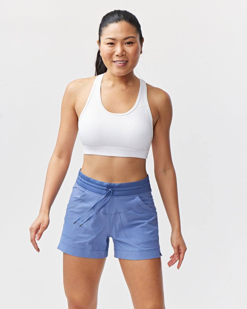 Triple V Womens Athletic Shorts in light blue woven fabric, with a mid-rise drawstring waistband and front pockets.
