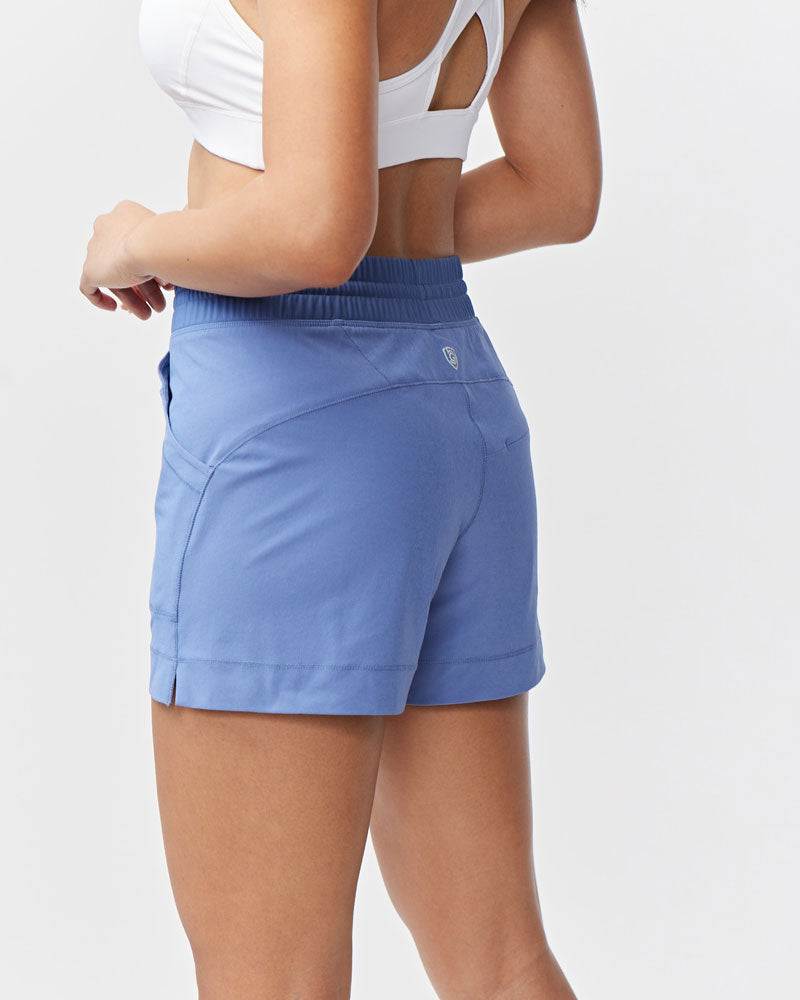 Triple V Womens Athletic Shorts in periwinkle blue with a wide elastic waistband, curved seams and a rear zip pocket