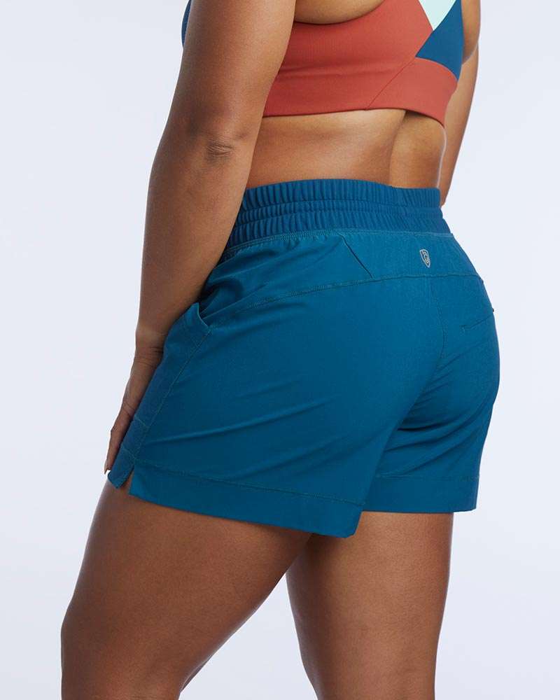 Triple V Womens Athletic Shorts in teal woven fabric with an elastic waistband, rear zip pocket and curved hems