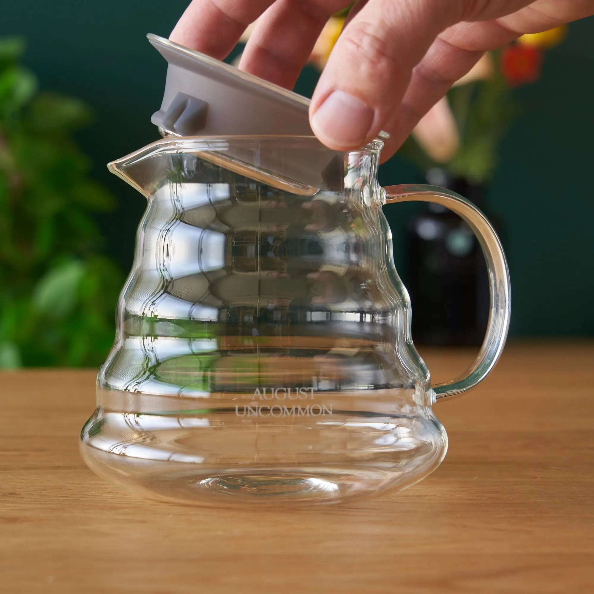 Two Cup Glass Teapot in clear heatproof glass with a curved handle, pouring spout, and fitted lid
