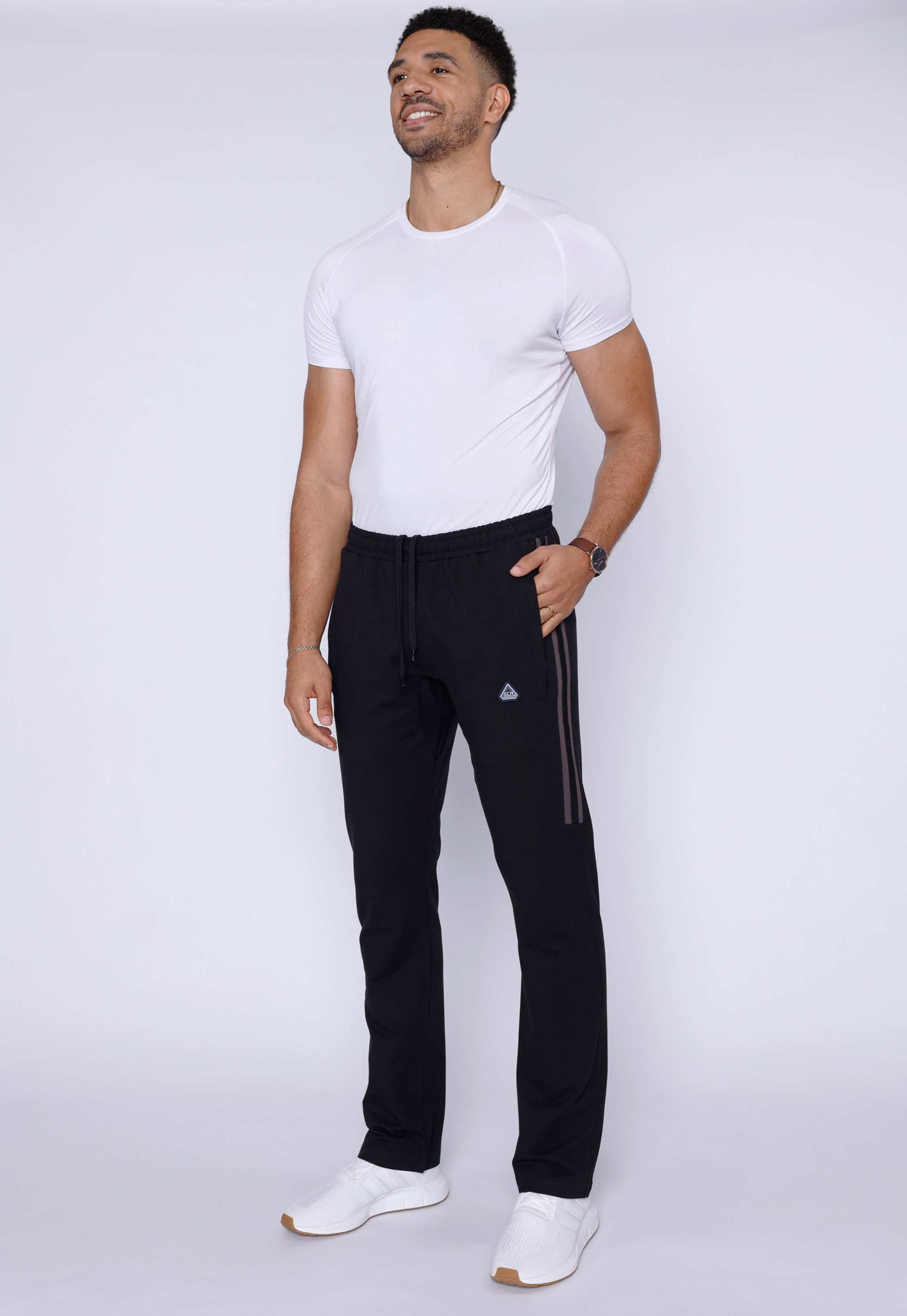 Ultimate Flex Athletic Sweatpants in black, with a straight-leg fit, elastic waistband, and small triangular logo