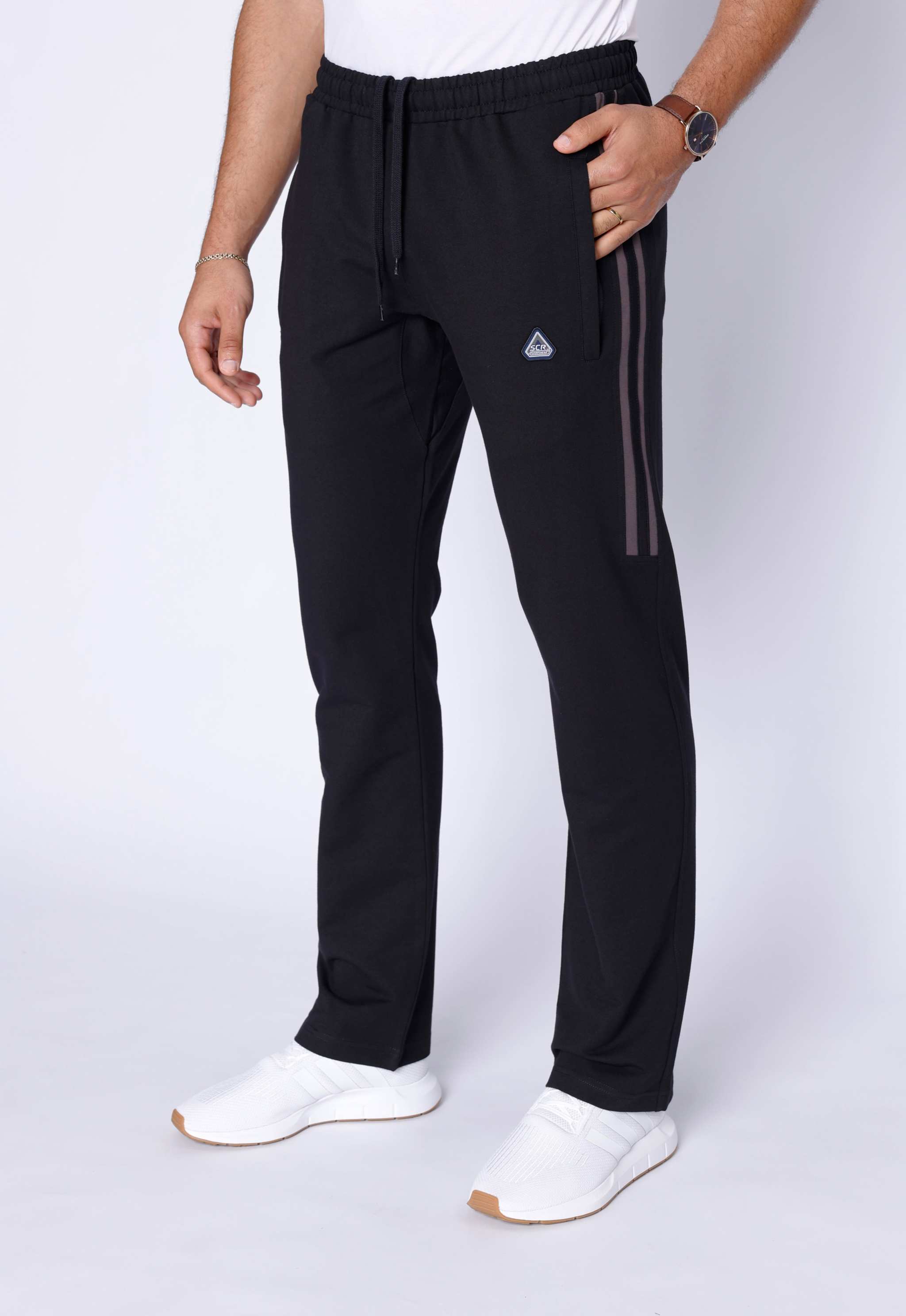 Ultimate Flex Athletic Sweatpants in black with a straight-leg cut, elastic waistband, drawstring, and subtle side stripes